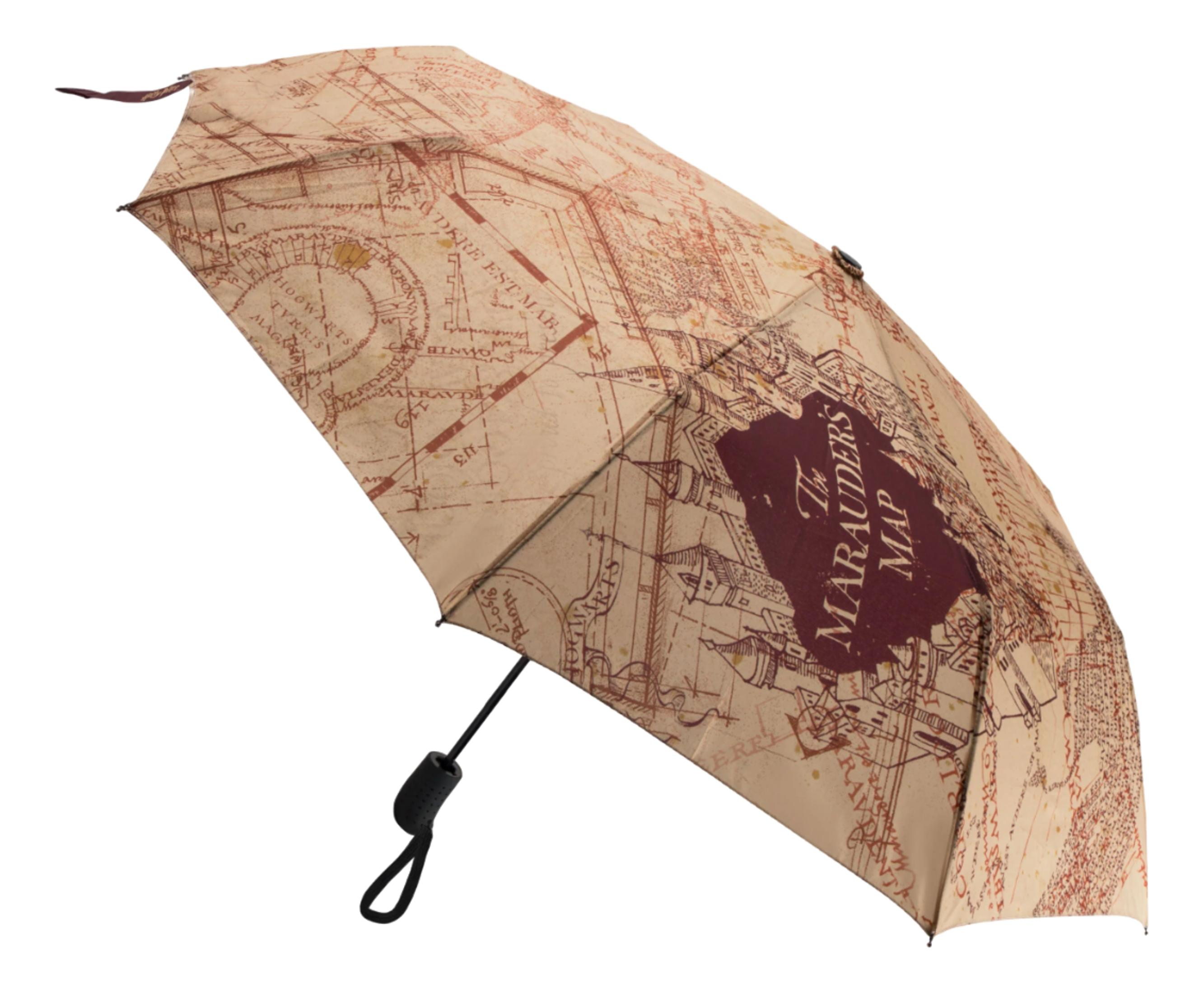 Ein beige und brauner Regenschirm mit der Karte der Rumtreiber.