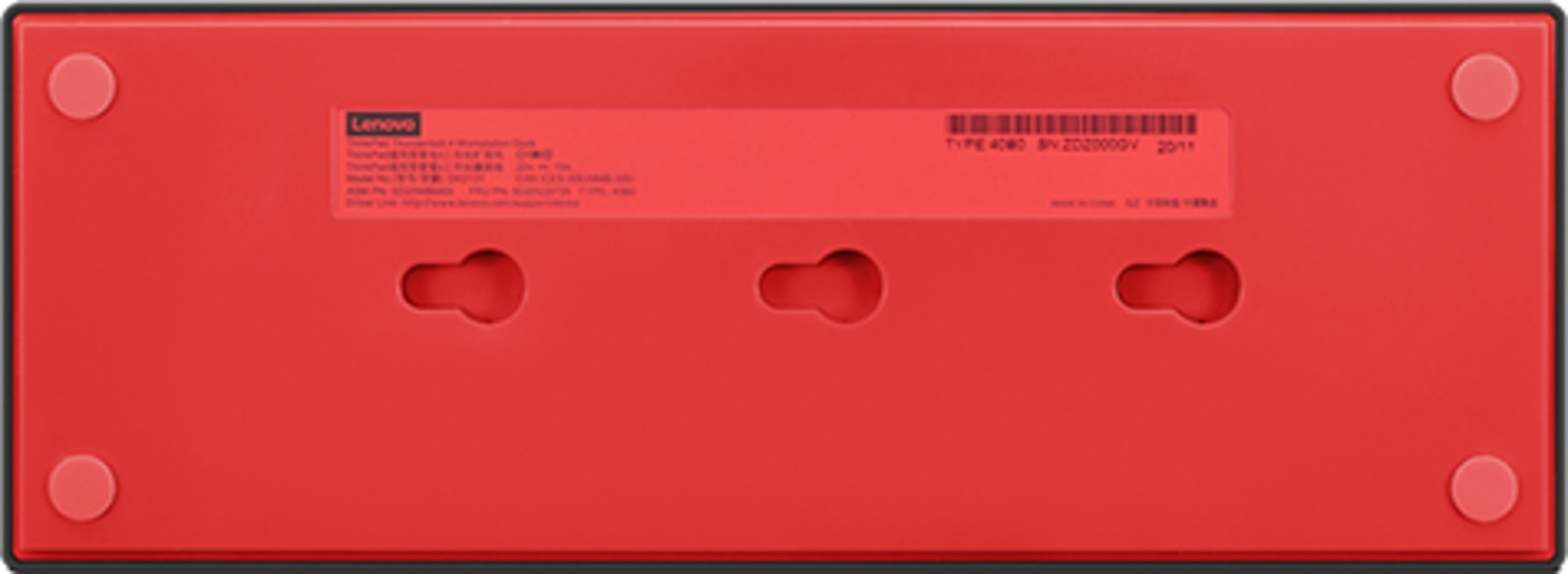 Dessous rouge d'une station d'accueil Lenovo avec quatre pieds en caoutchouc et trois trous de suspension.