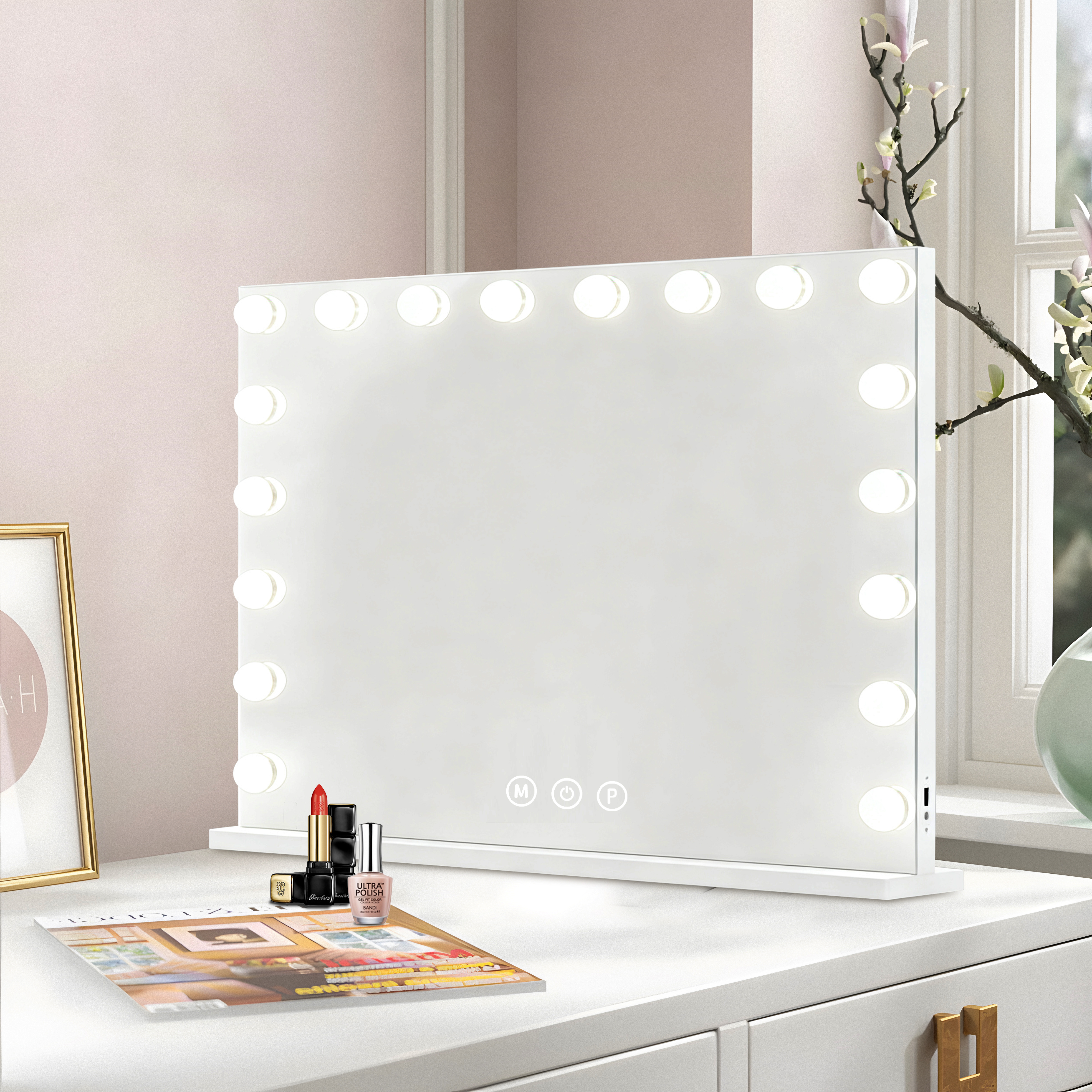 A lighted makeup mirror sits on a dresser next to lipstick and nail polish.