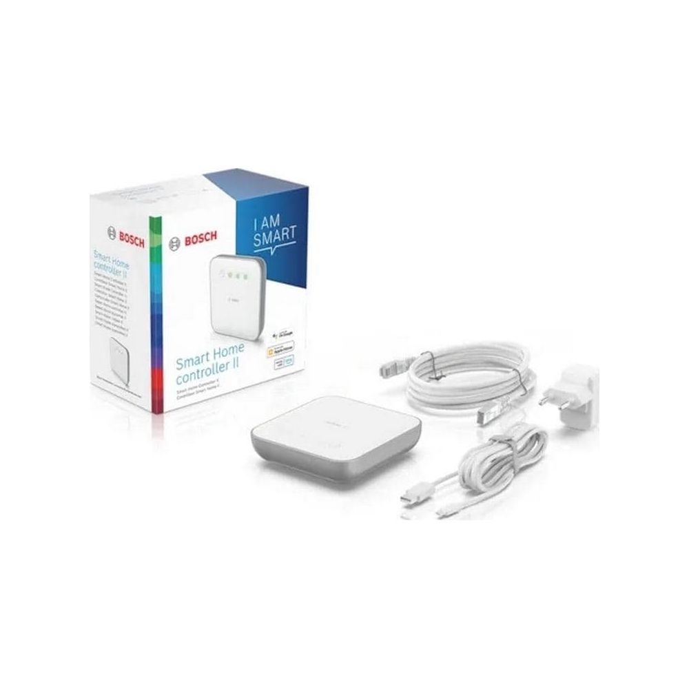 Bosch Smart Home Controller II z kablami i zasilaczem na białym tle.