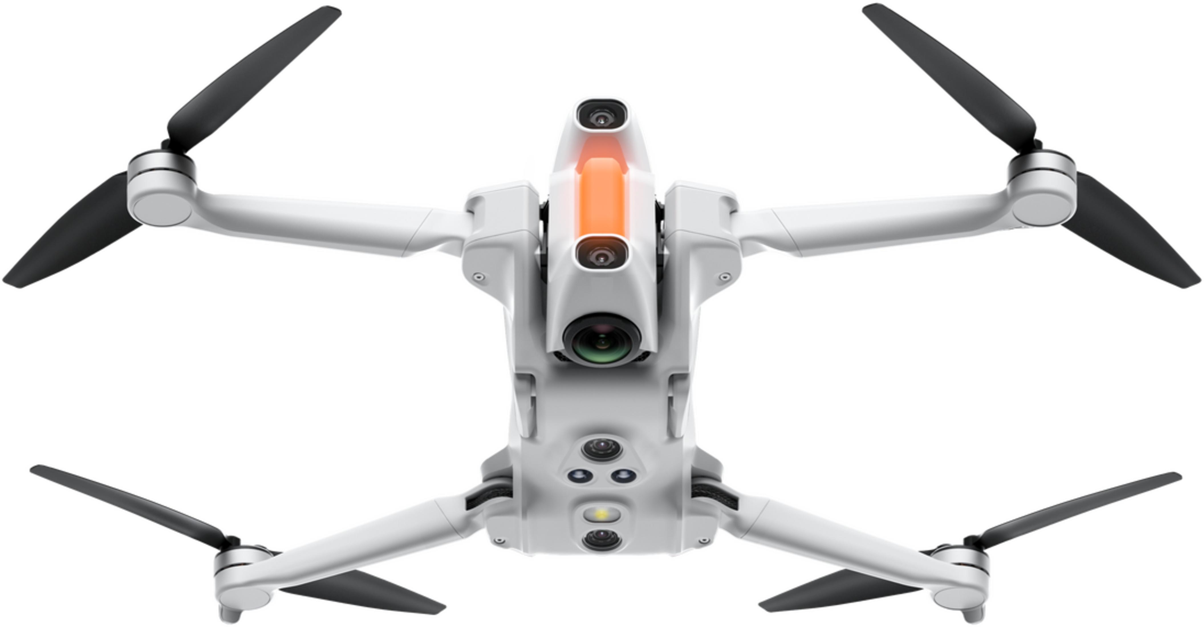 Biały dron czterowirnikowy z czarnymi śmigłami i kamerami.