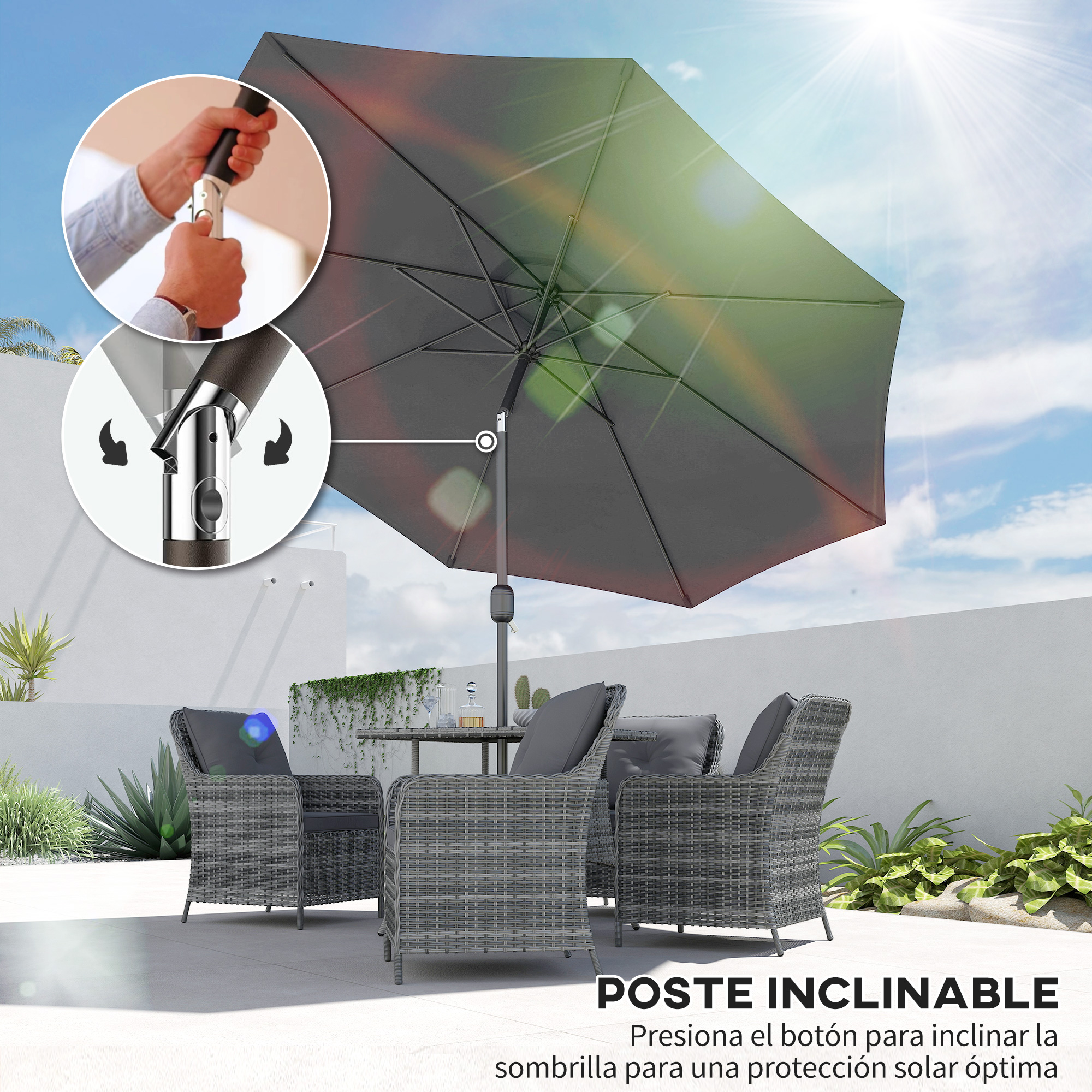 Un parasol gris con mecanismo de manivela sobre un juego de ratán exterior.