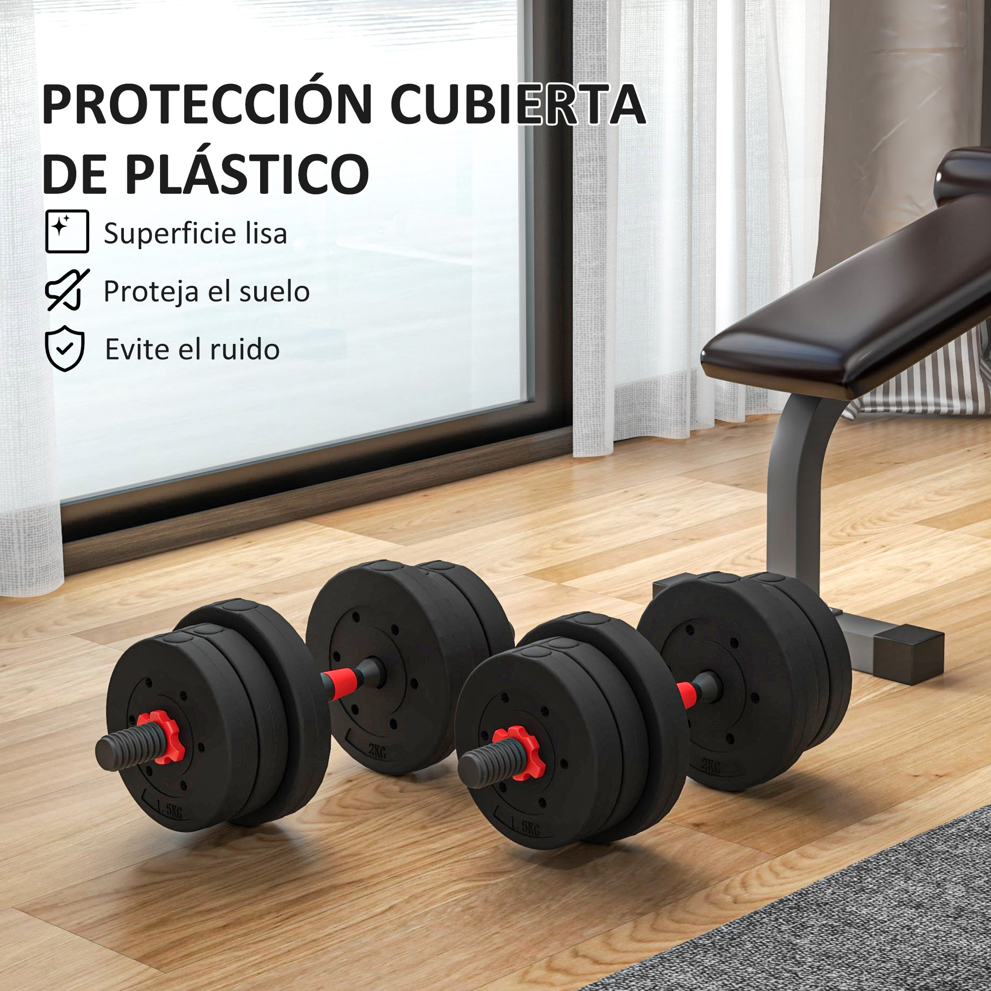 Mancuernas sobre suelo de madera con banco de pesas al fondo.