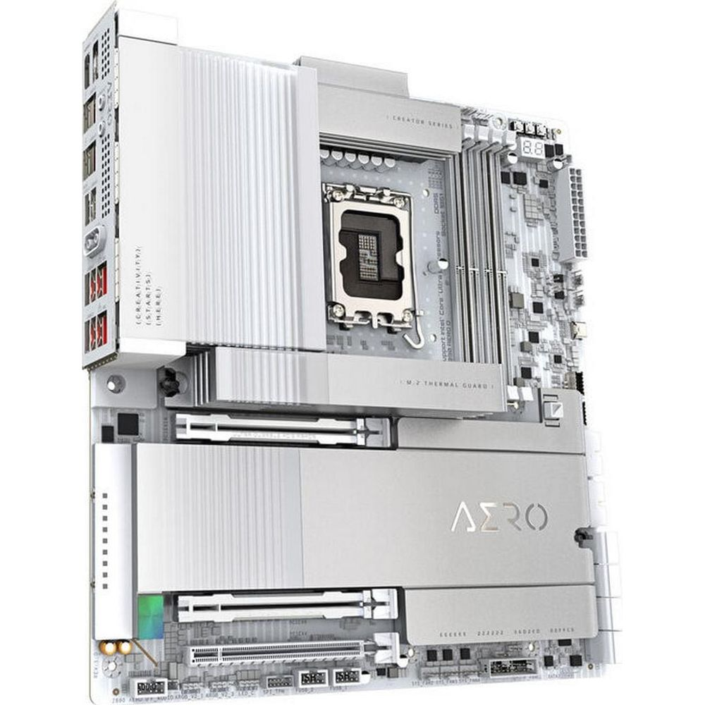 Biała płyta główna z gniazdem CPU, slotami RAM i radiatorami.