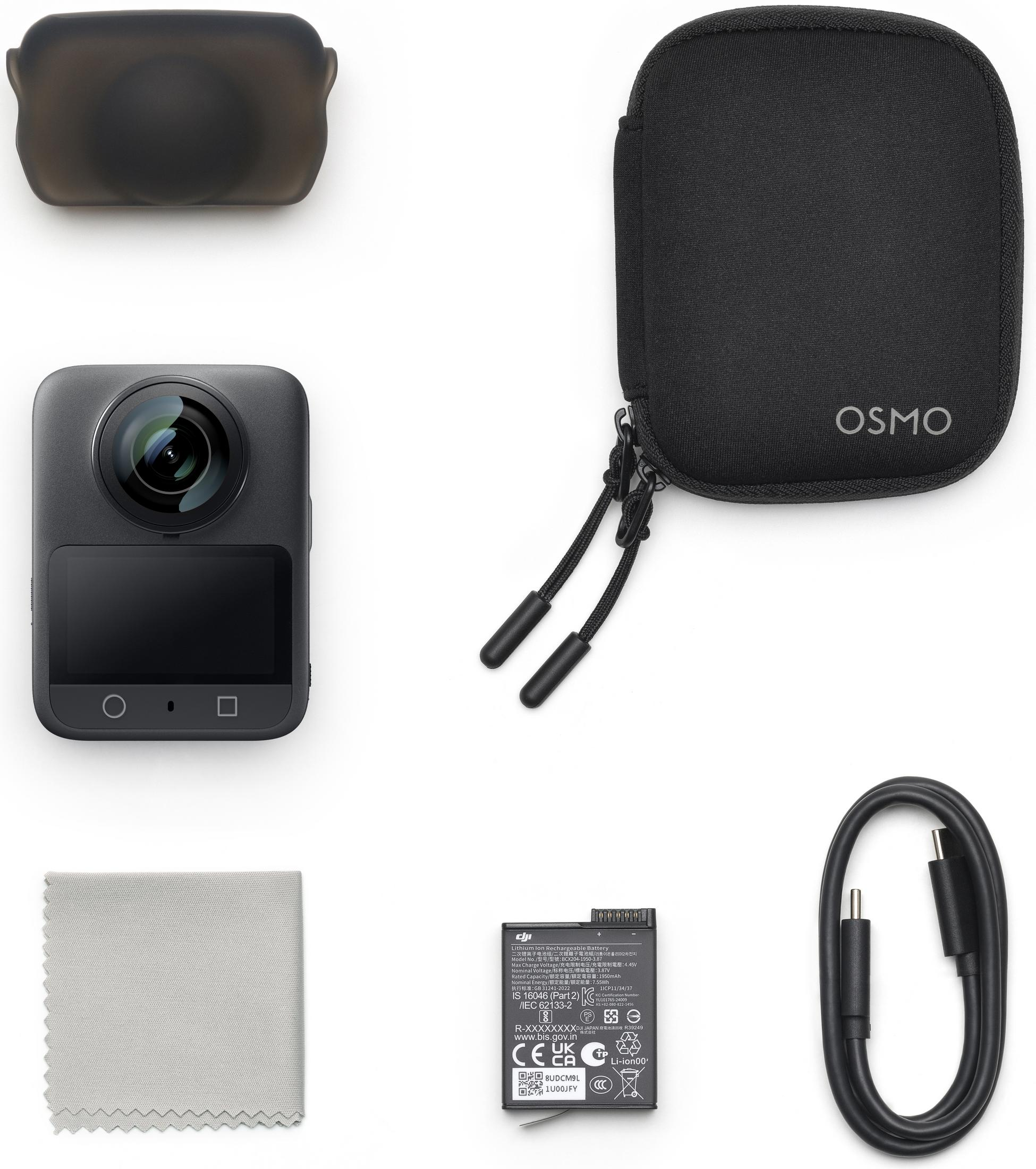 Ein graues Mikrofasertuch, eine schwarze Schutzhülle, eine Kamera, eine schwarze Tasche, ein Akku und ein USB-Kabel.