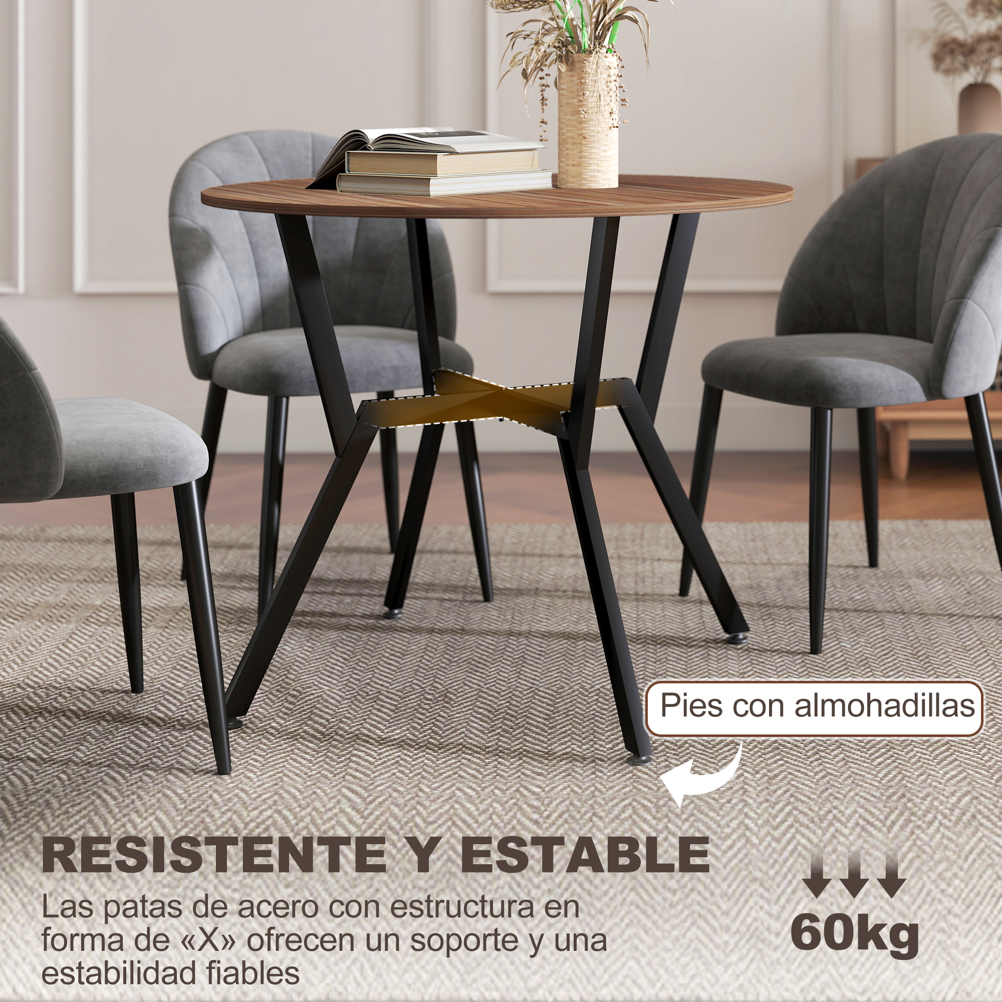 Mesa redonda de madera con cuatro sillas grises y patas metálicas. Decoración en mesa.