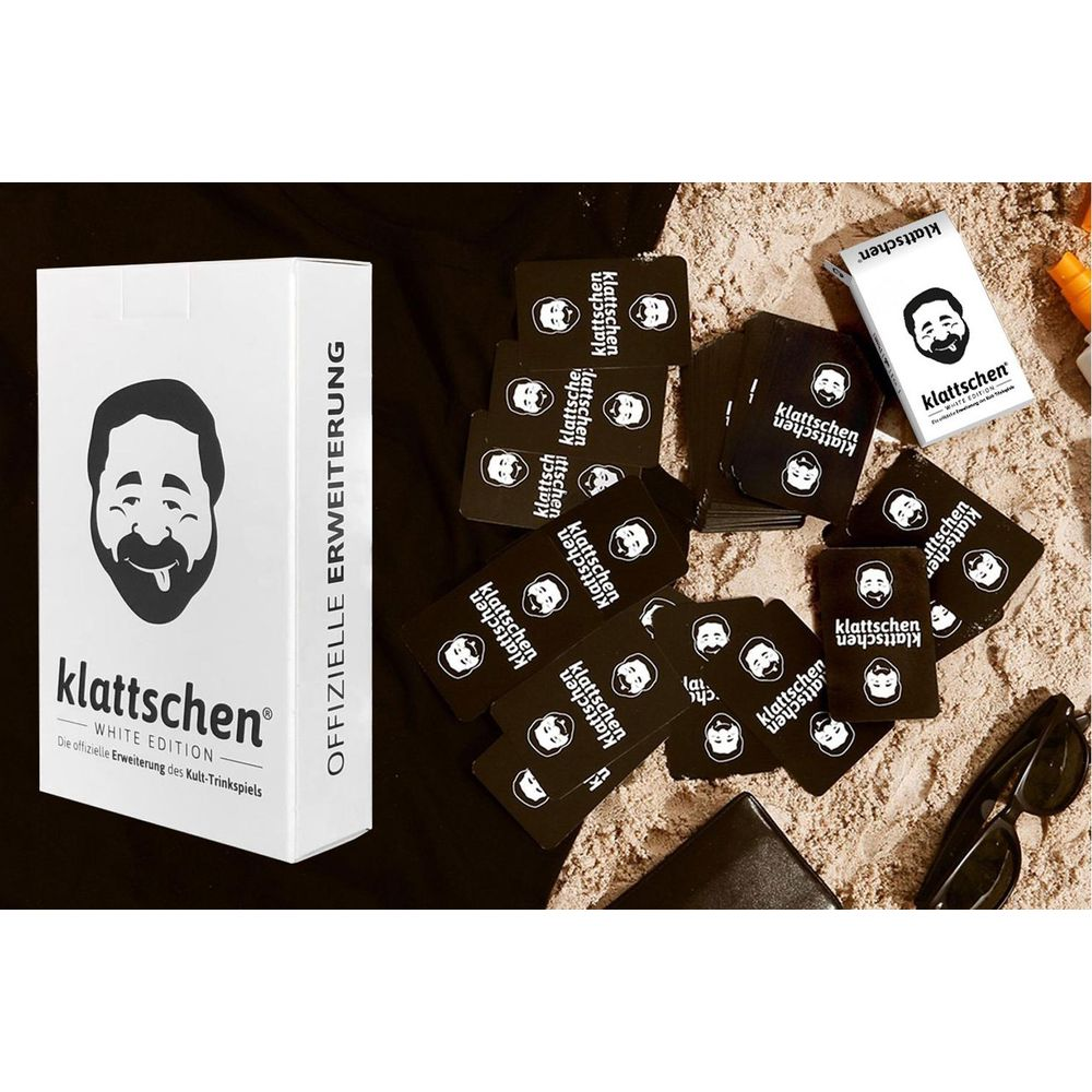 Ein Kartenspiel mit einem weißen Karton und vielen schwarzen Karten mit einem Gesicht.