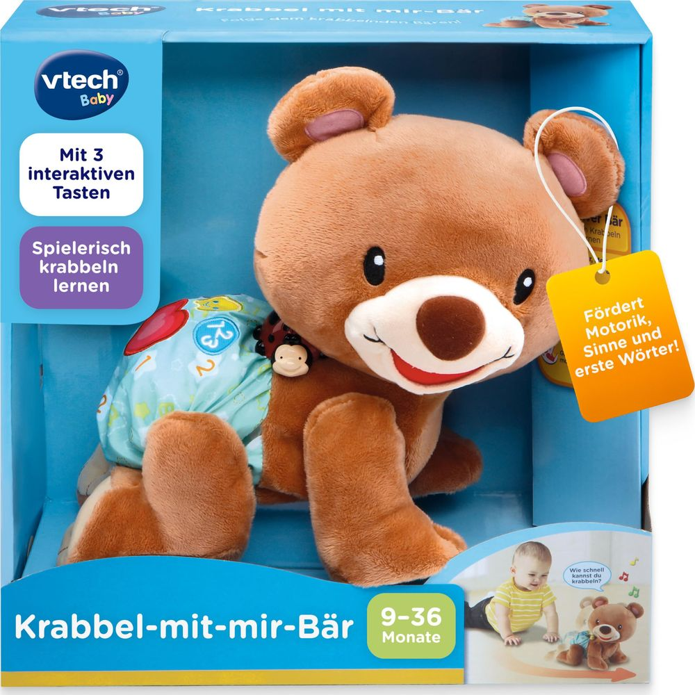 Ein brauner Teddybär in einer blauen Box mit gelbem Anhänger.