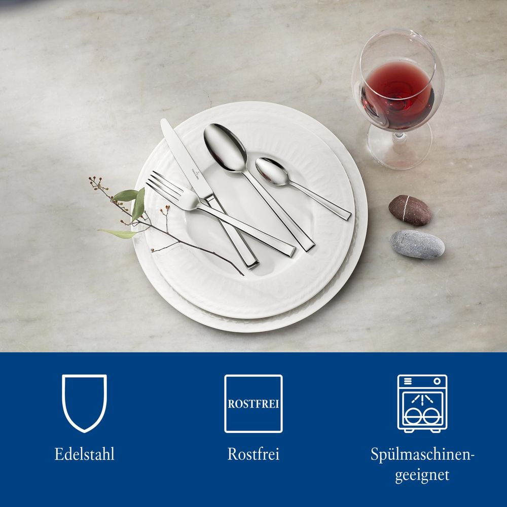Edelstahlbesteck auf Teller, Weinglas mit Rotwein, Steine, Zweig. Icons für Edelstahl, Rostfrei, Spülmaschine.