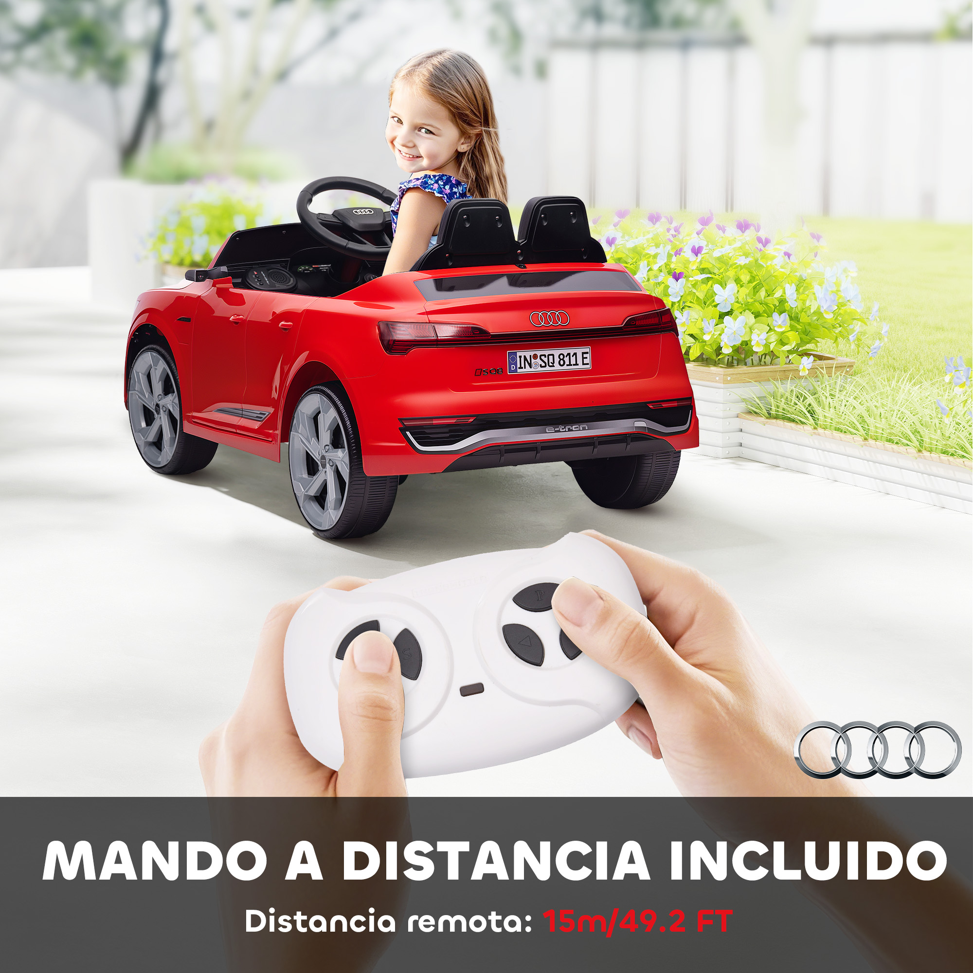 Un coche eléctrico Audi rojo para niños con una niña al volante y un mando a distancia.