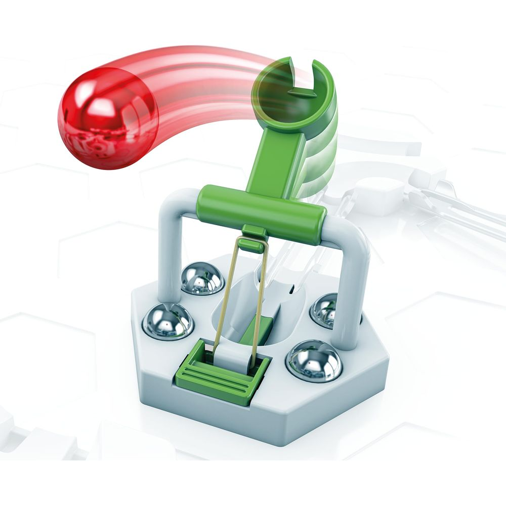 Une balle rouge se dirige vers un dispositif mécanique vert.