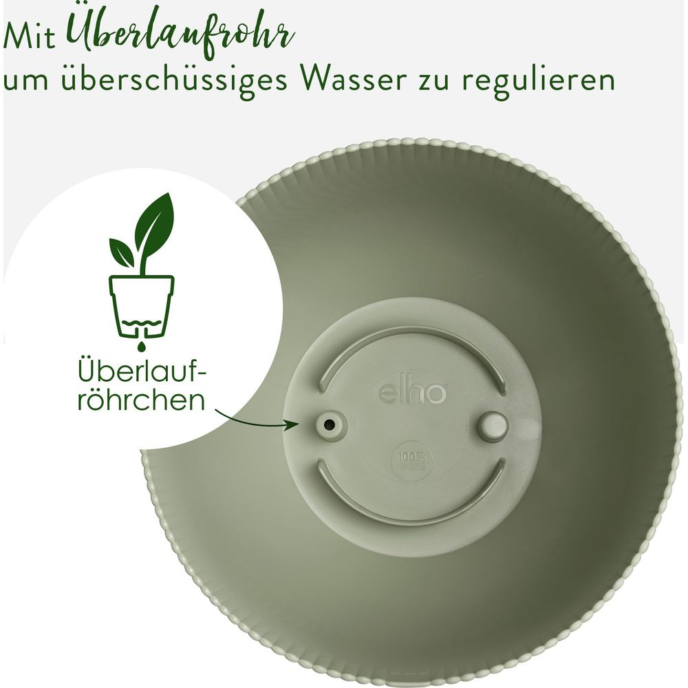 Ein grüner Blumentopf mit einem Überlaufrohr zur Wasserregulierung.