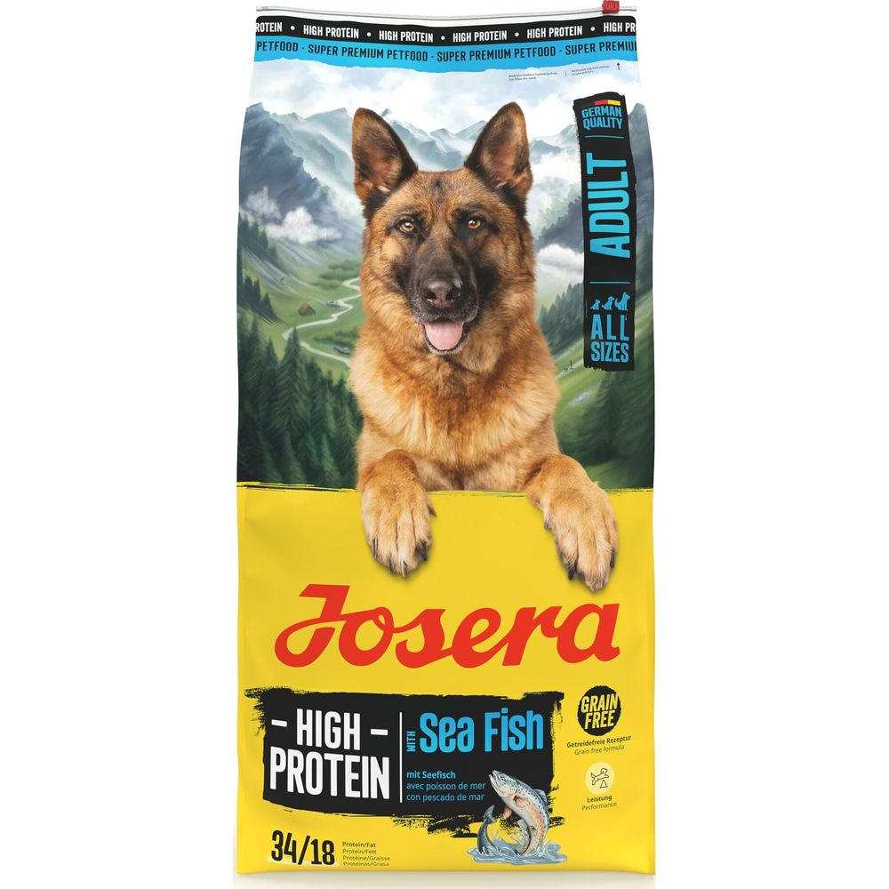 Ein Deutscher Schäferhund blickt über eine Packung Hundefutter mit Meeresfisch.