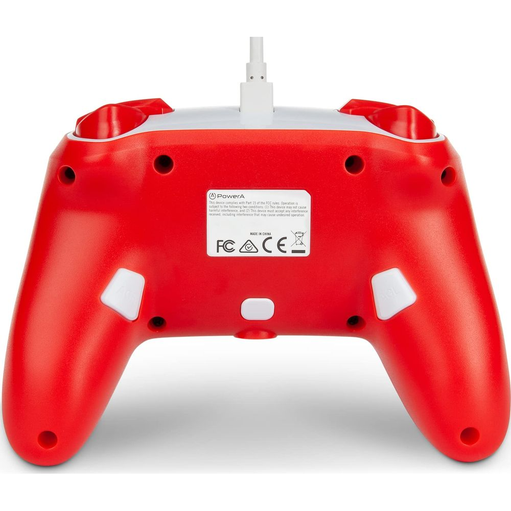 Czerwono-biały kontroler do gier wideo, widok od tyłu. Przyciski, kabel i etykiety FCC/CE.
