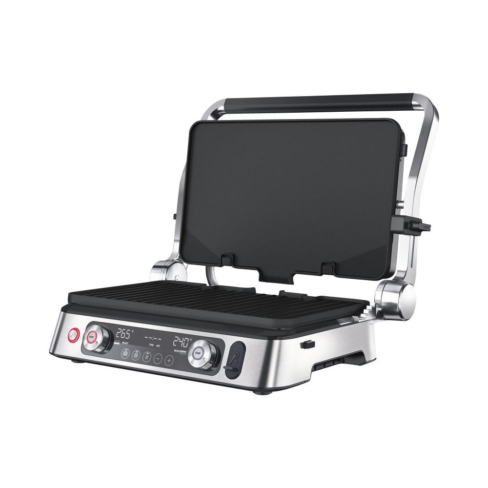Otwarty, srebrny grill kontaktowy z czarnymi płytami i cyfrowym wyświetlaczem.
