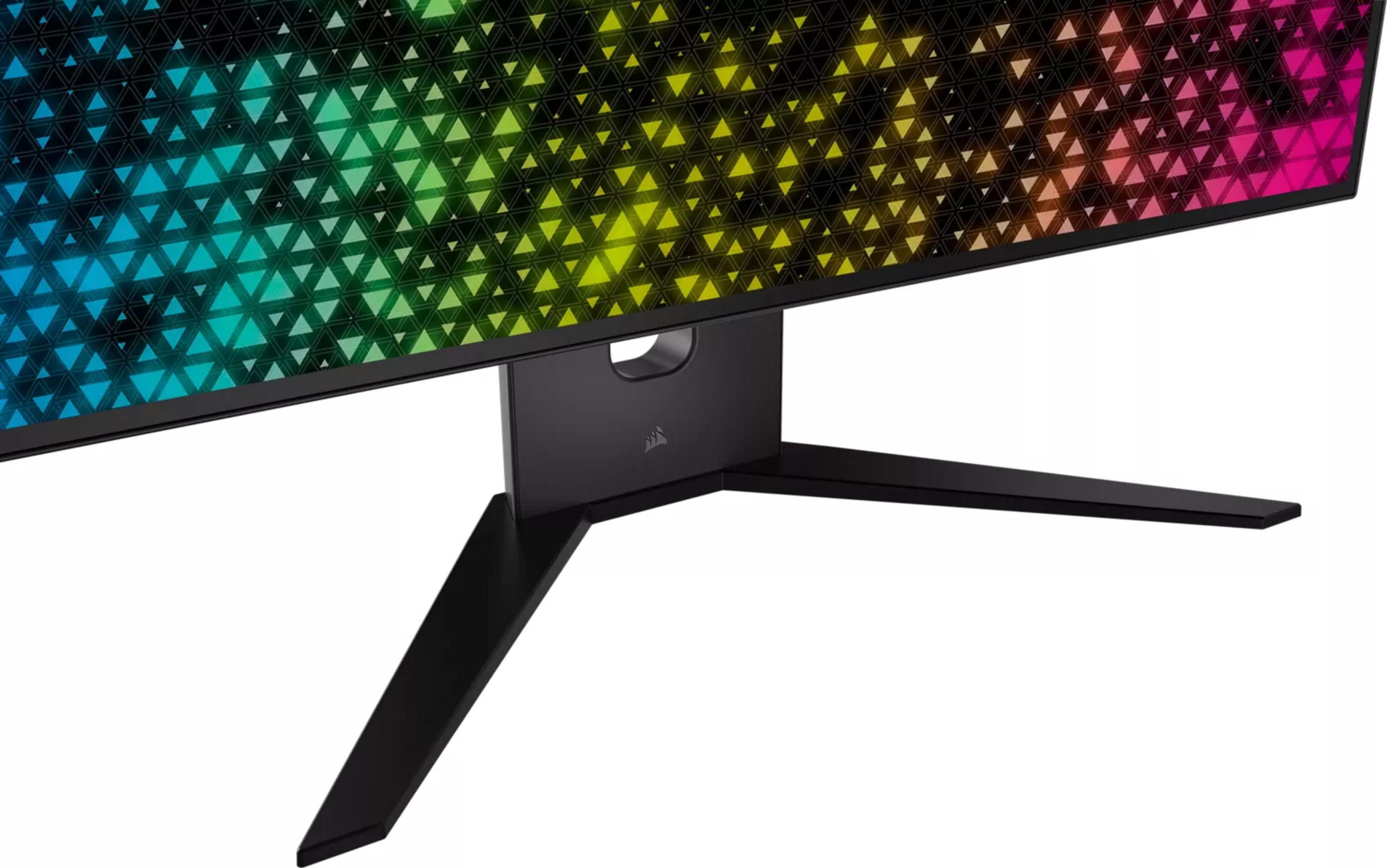 Czarny stojak monitora z tęczowym, trójkątnym wzorem w tle.
