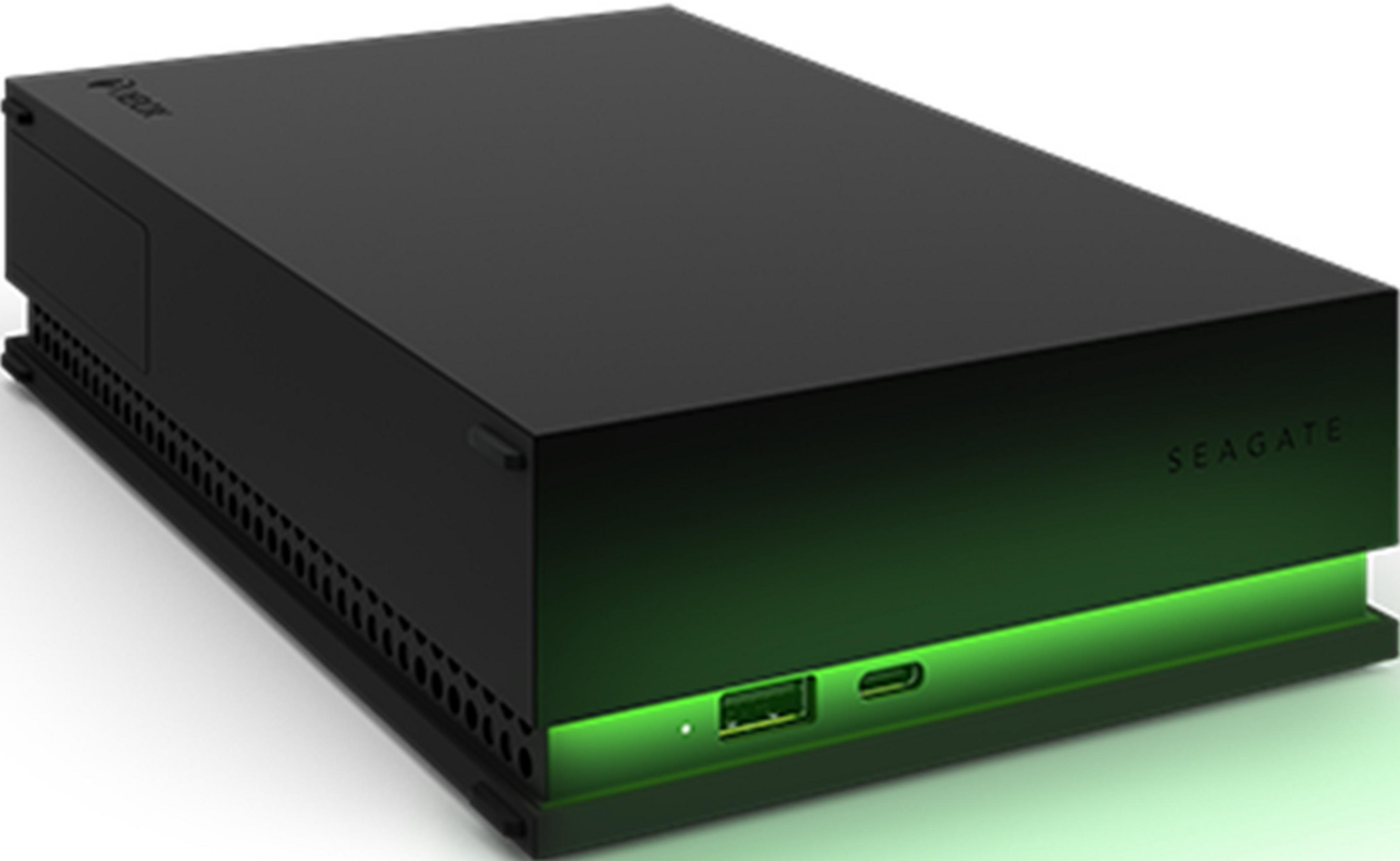 Disco duro externo negro con logo de Xbox e iluminación verde.