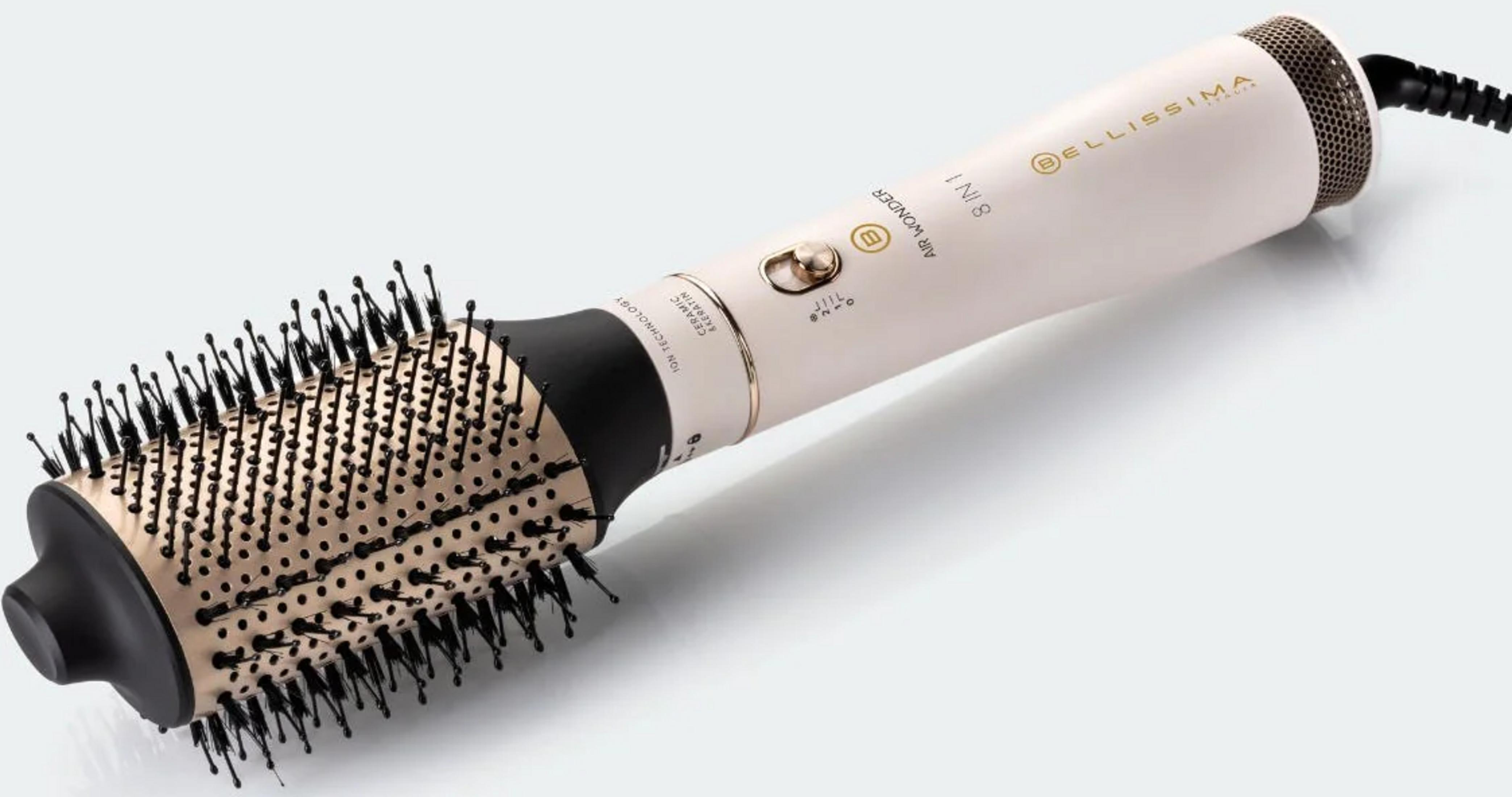 Beżowy elektryczny styler do włosów z czarną rączką i złotą szczotką.