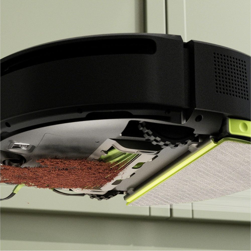 Odkurzacz automatyczny z szczotkami i brudem.