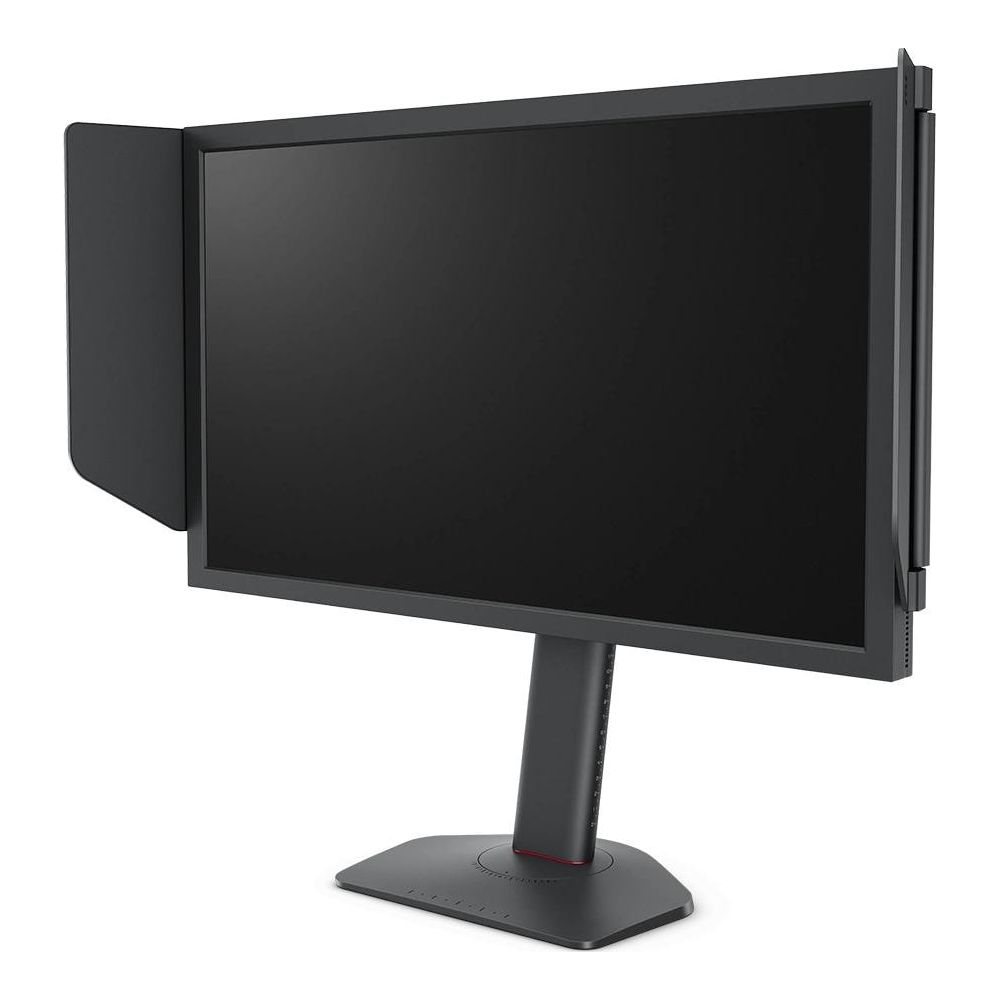 Un monitor per computer nero con paraluce, su supporto scuro.