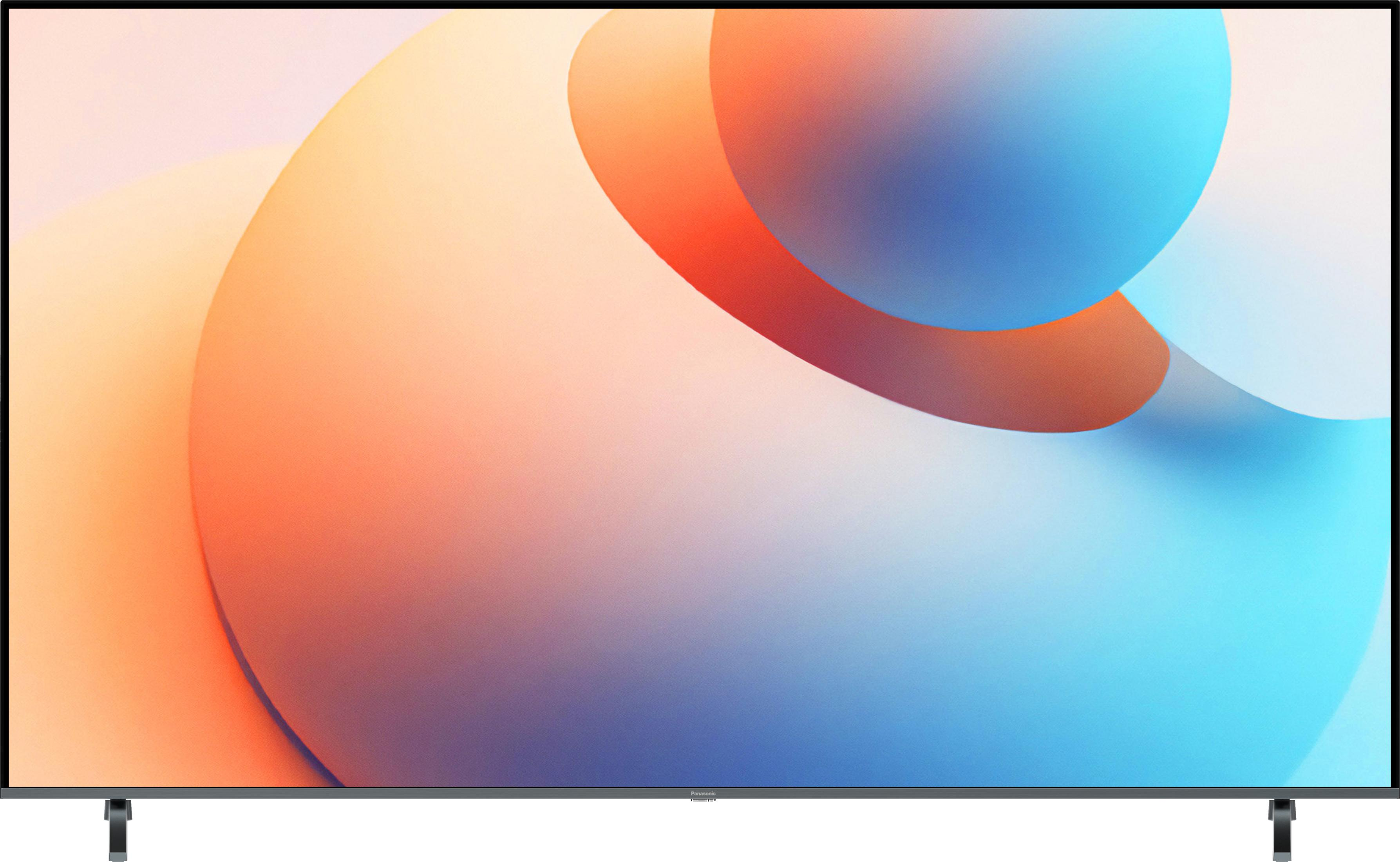Un televisore moderno con uno sfondo astratto e colorato nei toni dell'arancione e del blu.
