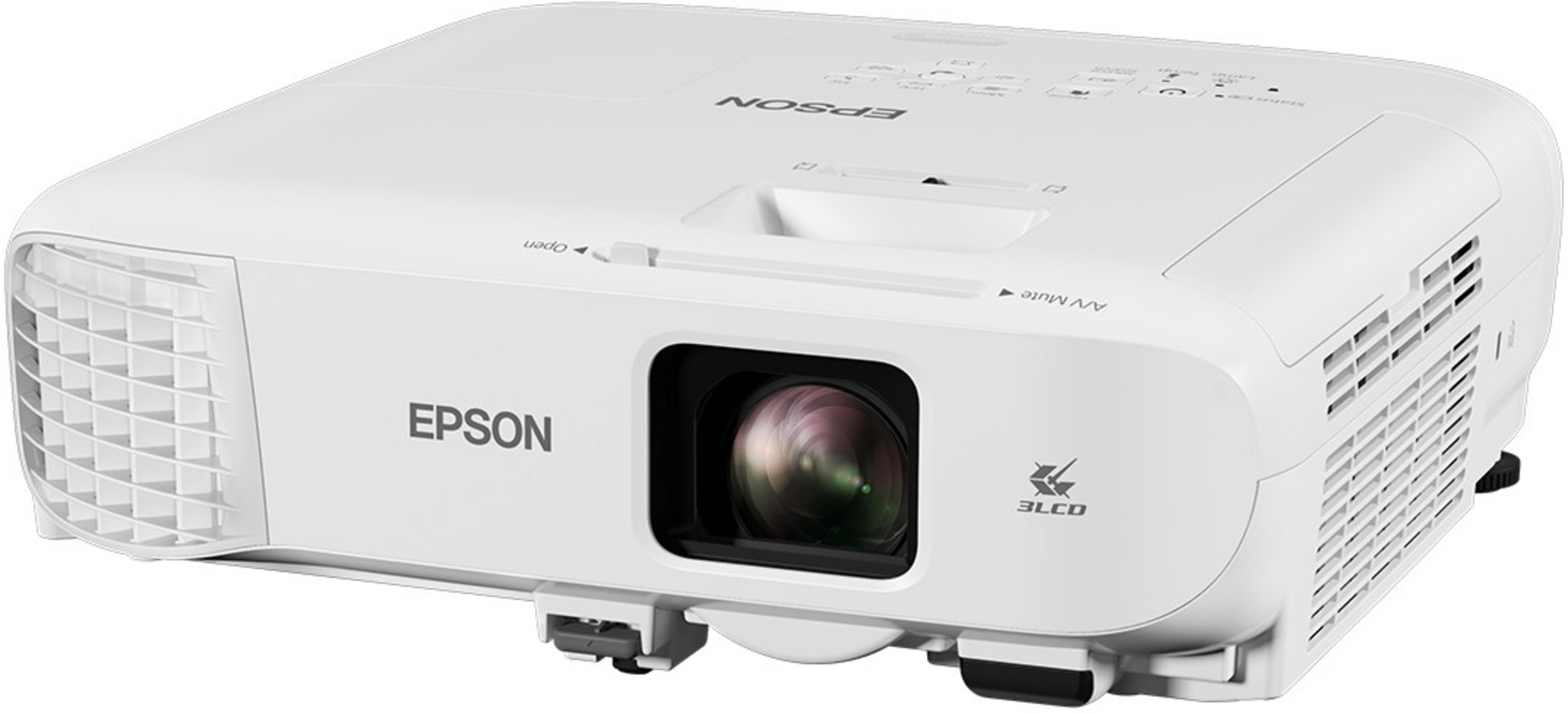 Un proyector Epson blanco con lente negro y detalles plateados sobre superficie blanca.