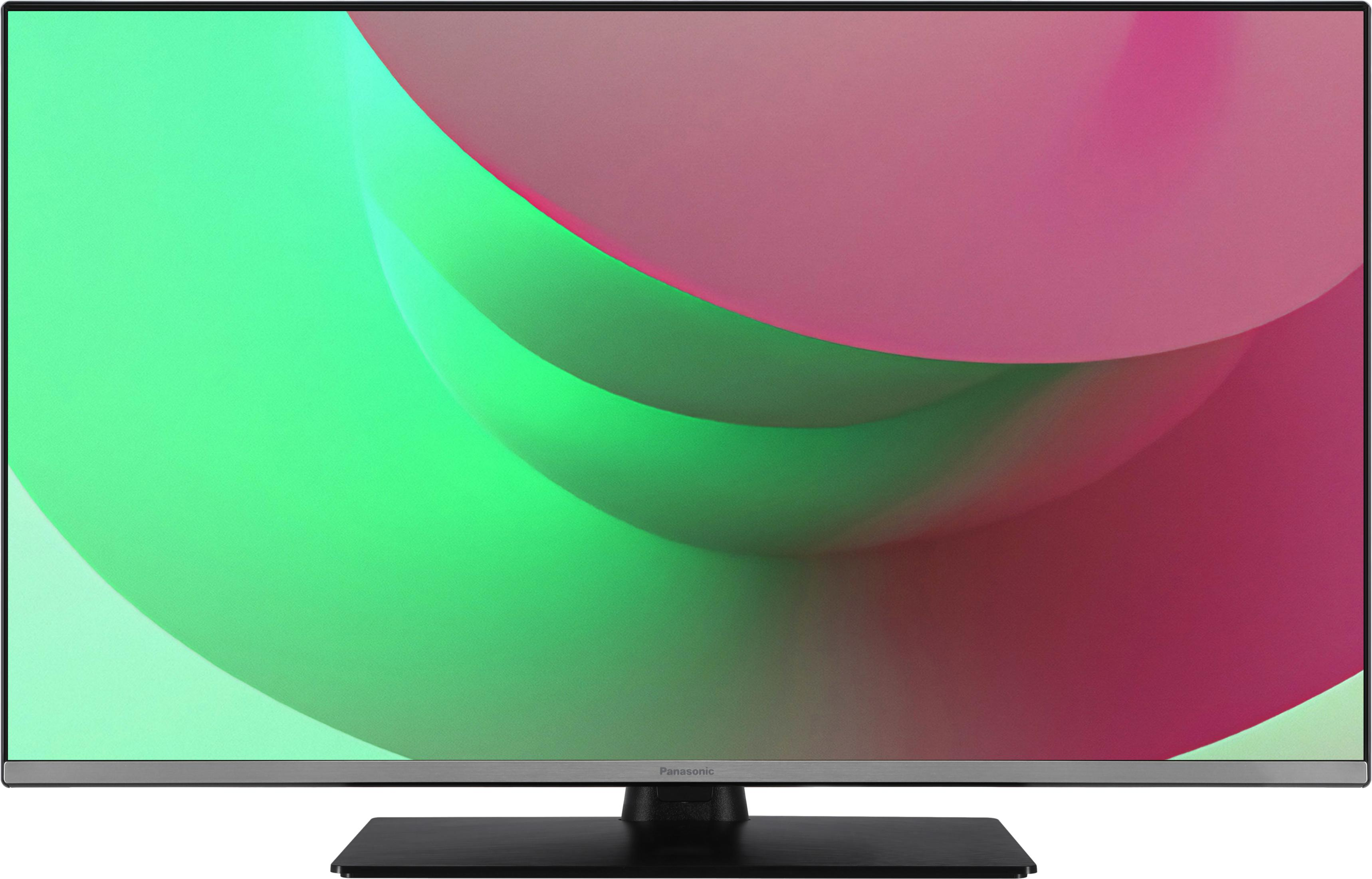 Telewizor Panasonic wyświetla abstrakcyjną grafikę z zielonymi i różowymi gradientami.