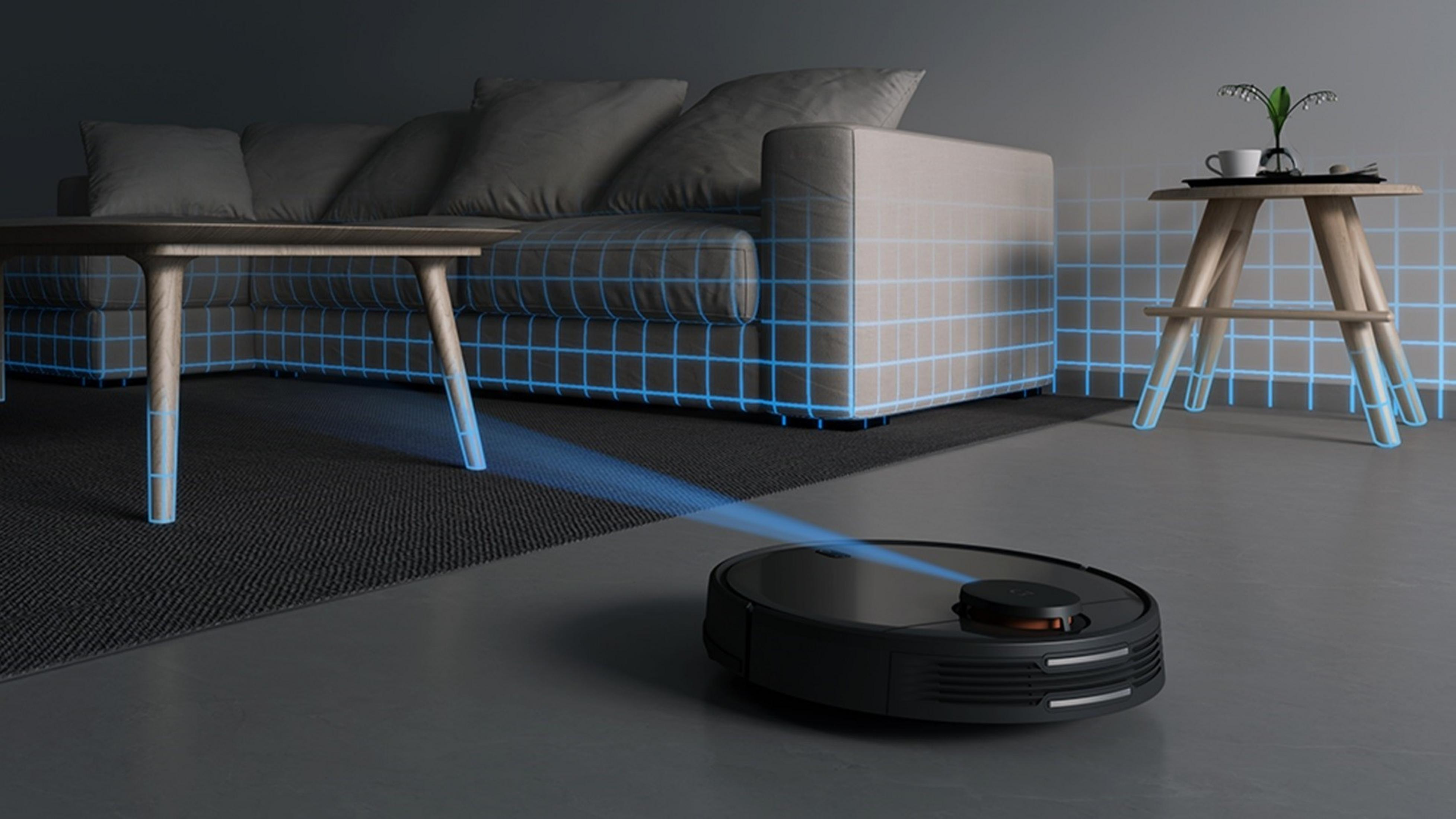 Un robot aspirador escanea una sala de estar con muebles y líneas de cuadrícula azules.
