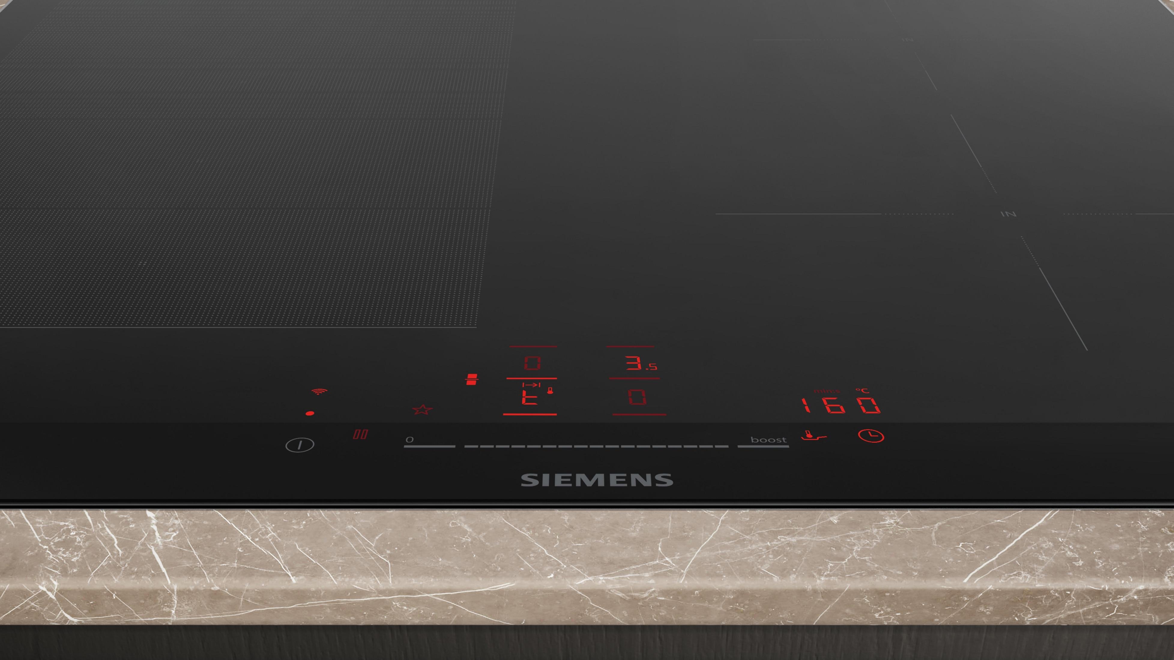 Schwarzes Induktionskochfeld mit roter Digitalanzeige und Siemens-Logo.