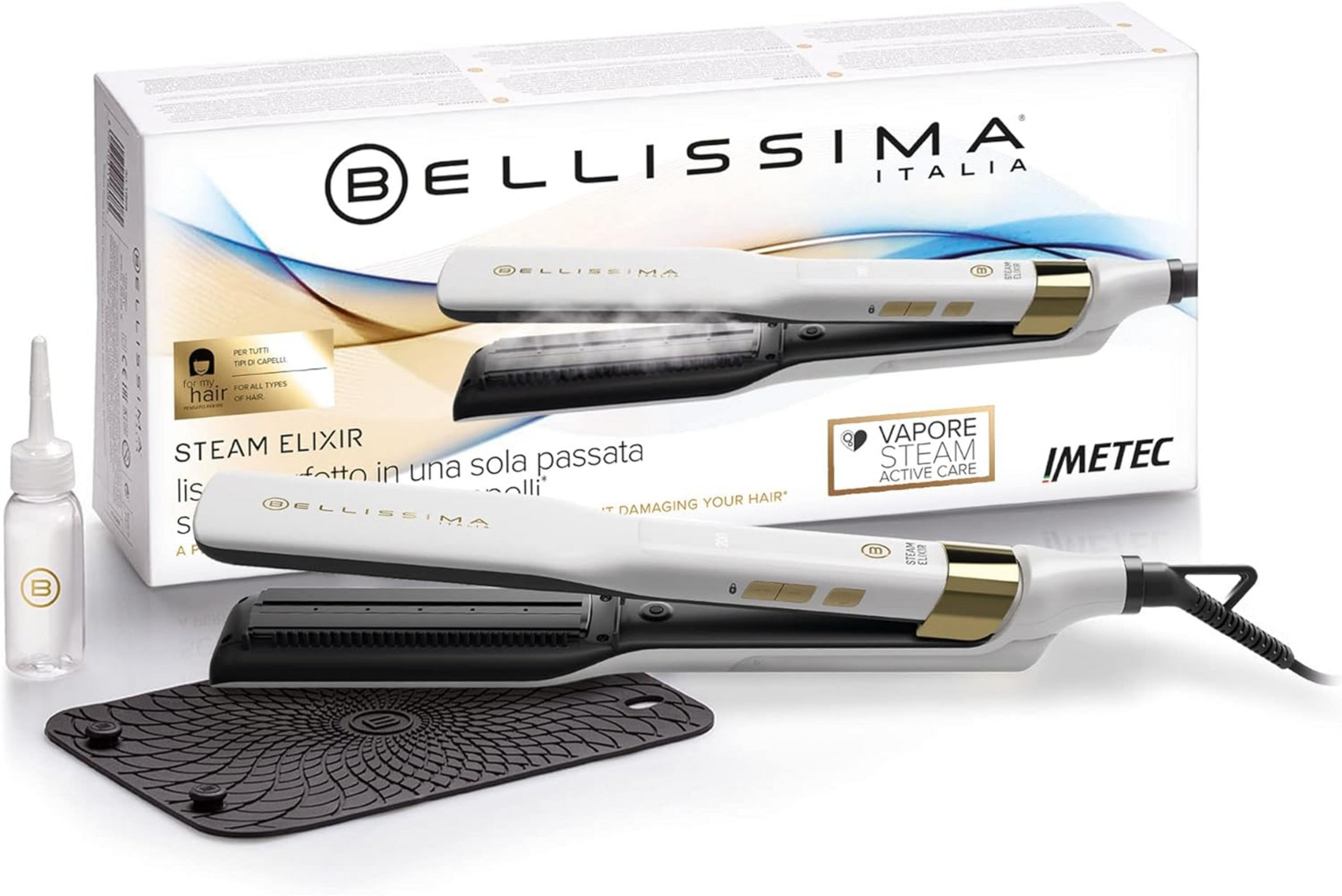 Biała prostownica parowa ze złotymi akcentami i akcesoriami przed opakowaniem.