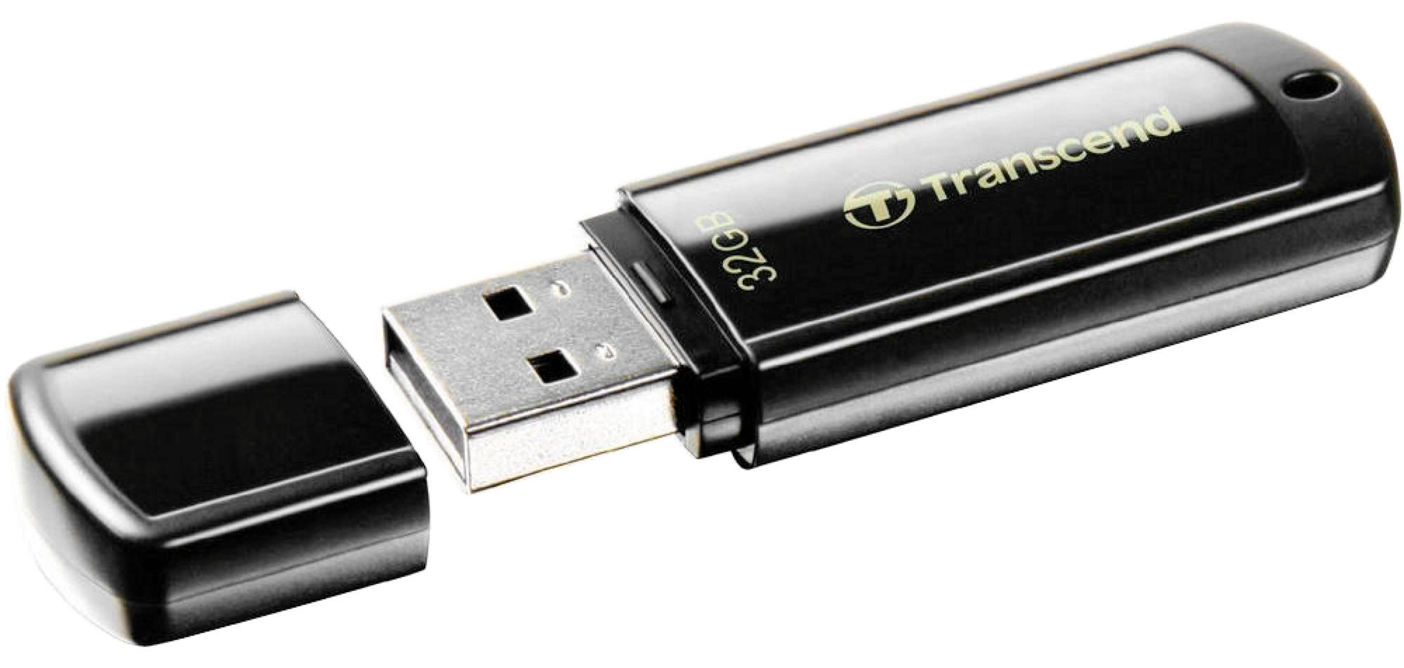 Czarny pendrive Transcend 32 GB z nakrętką obok.