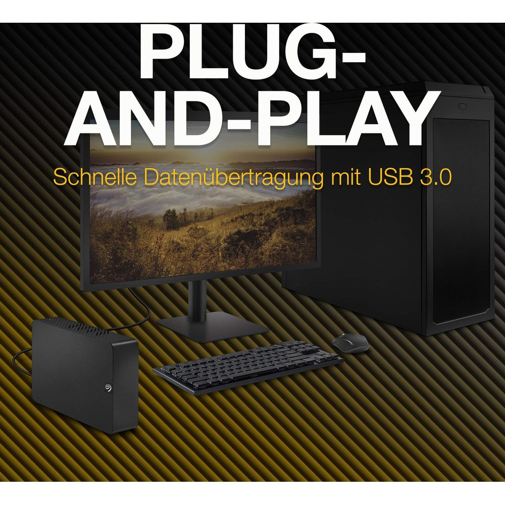 Komputer, monitor, klawiatura, mysz i dysk zewnętrzny na stole.