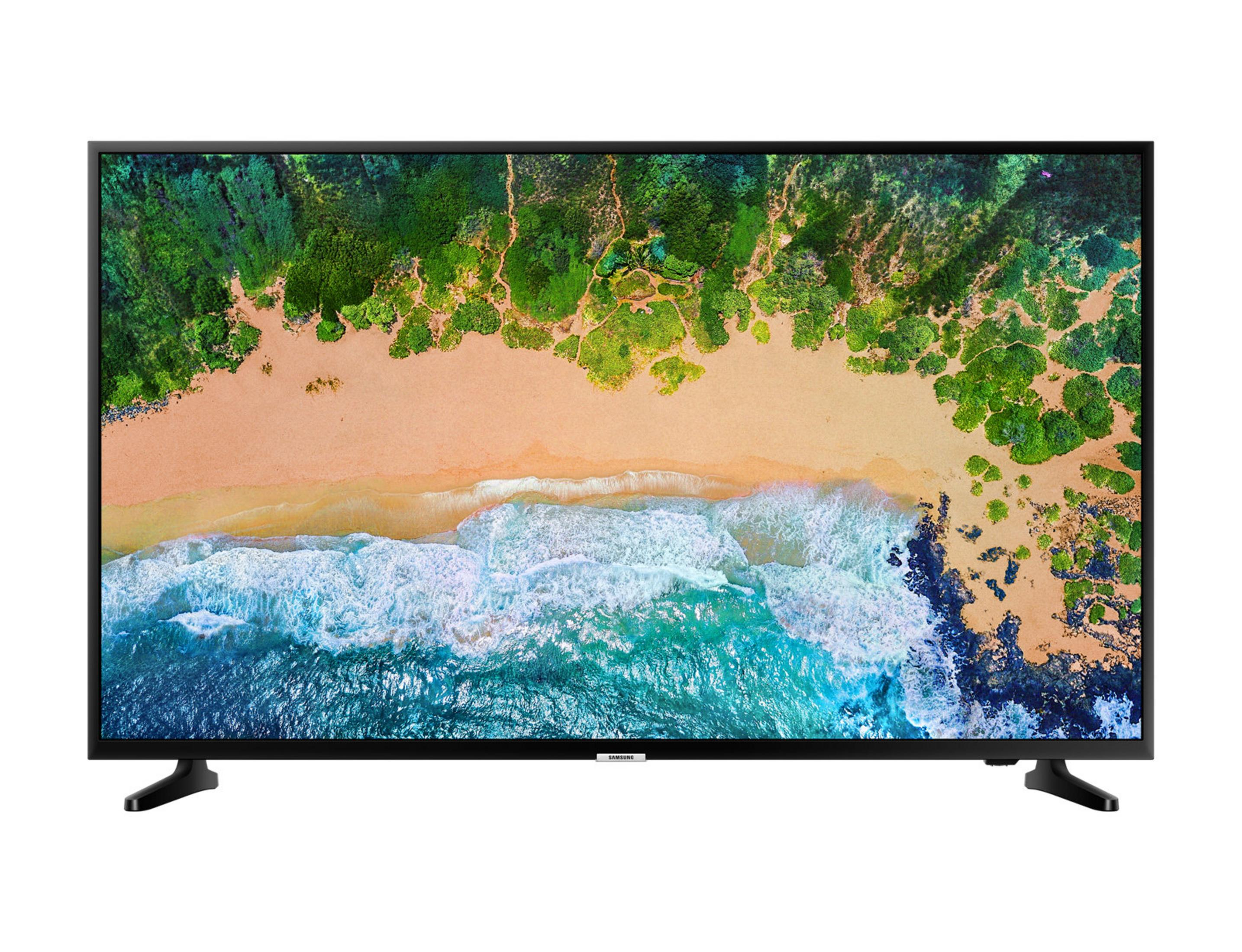 Un moderno televisore nero che mostra un'immagine di spiaggia tropicale e oceano.