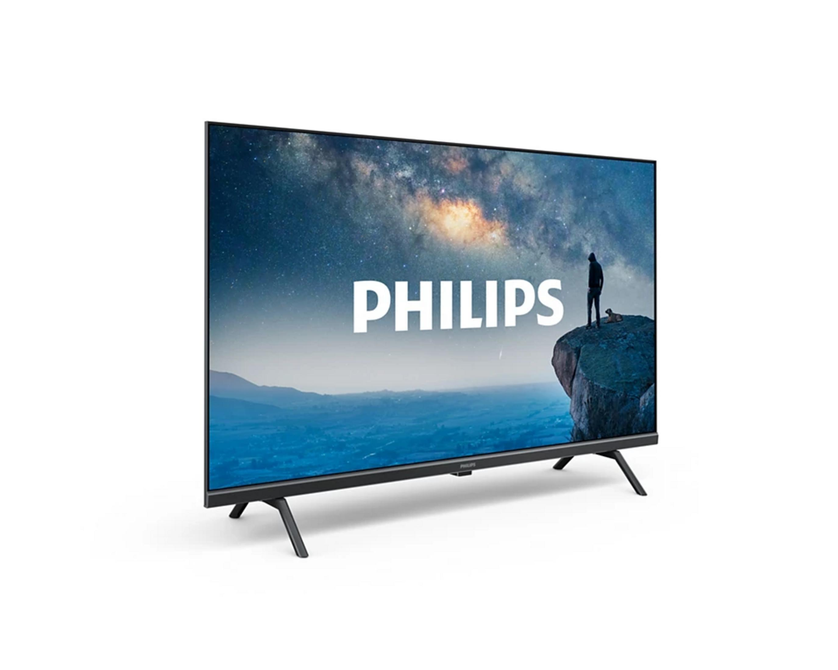 Ein Philips-Fernseher zeigt eine Landschaft mit Sternenhimmel und einer Person auf einem Felsen.