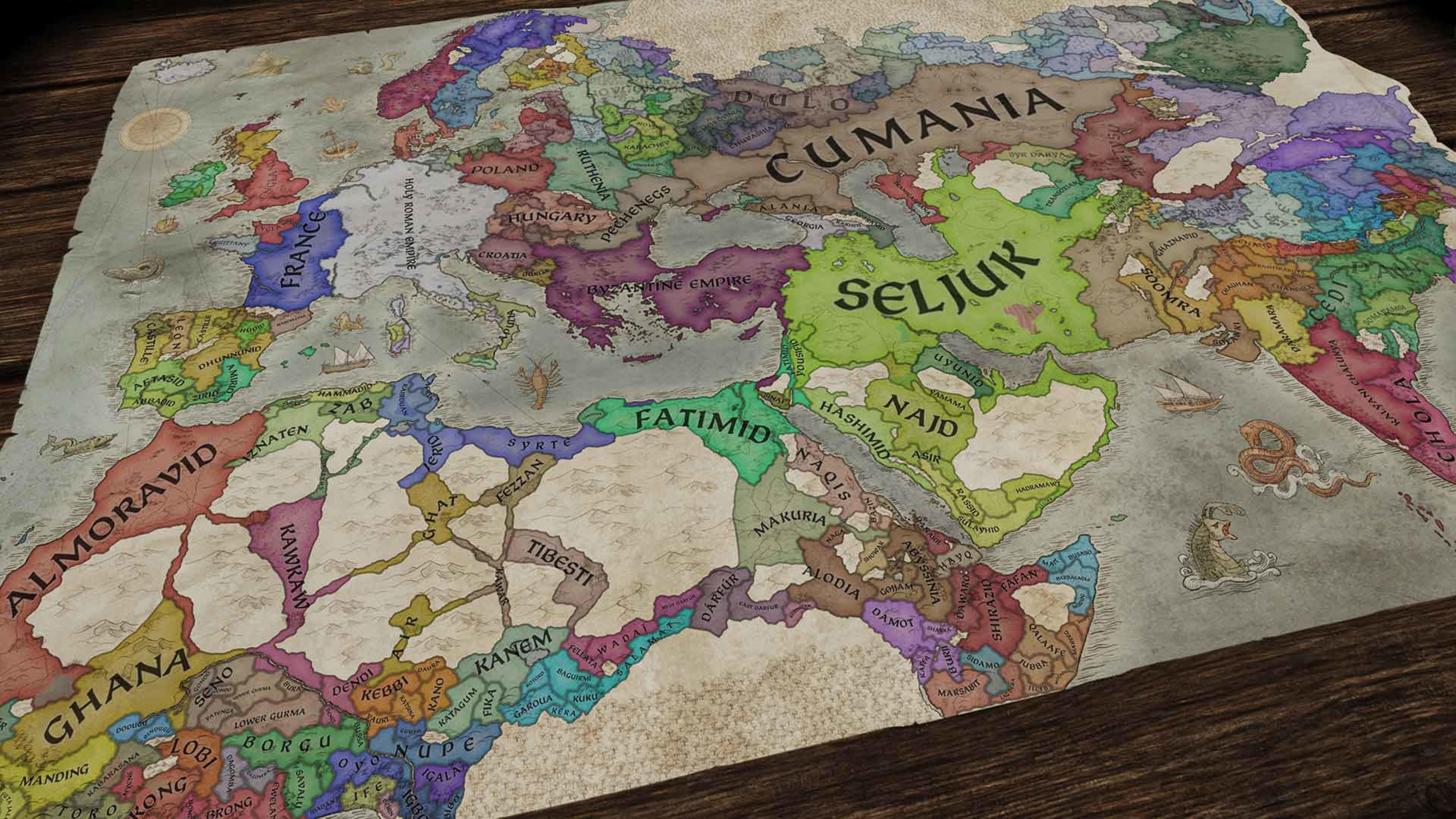 Średniowieczna mapa przedstawia Europę i Afrykę Północną z kolorowymi prowincjami.