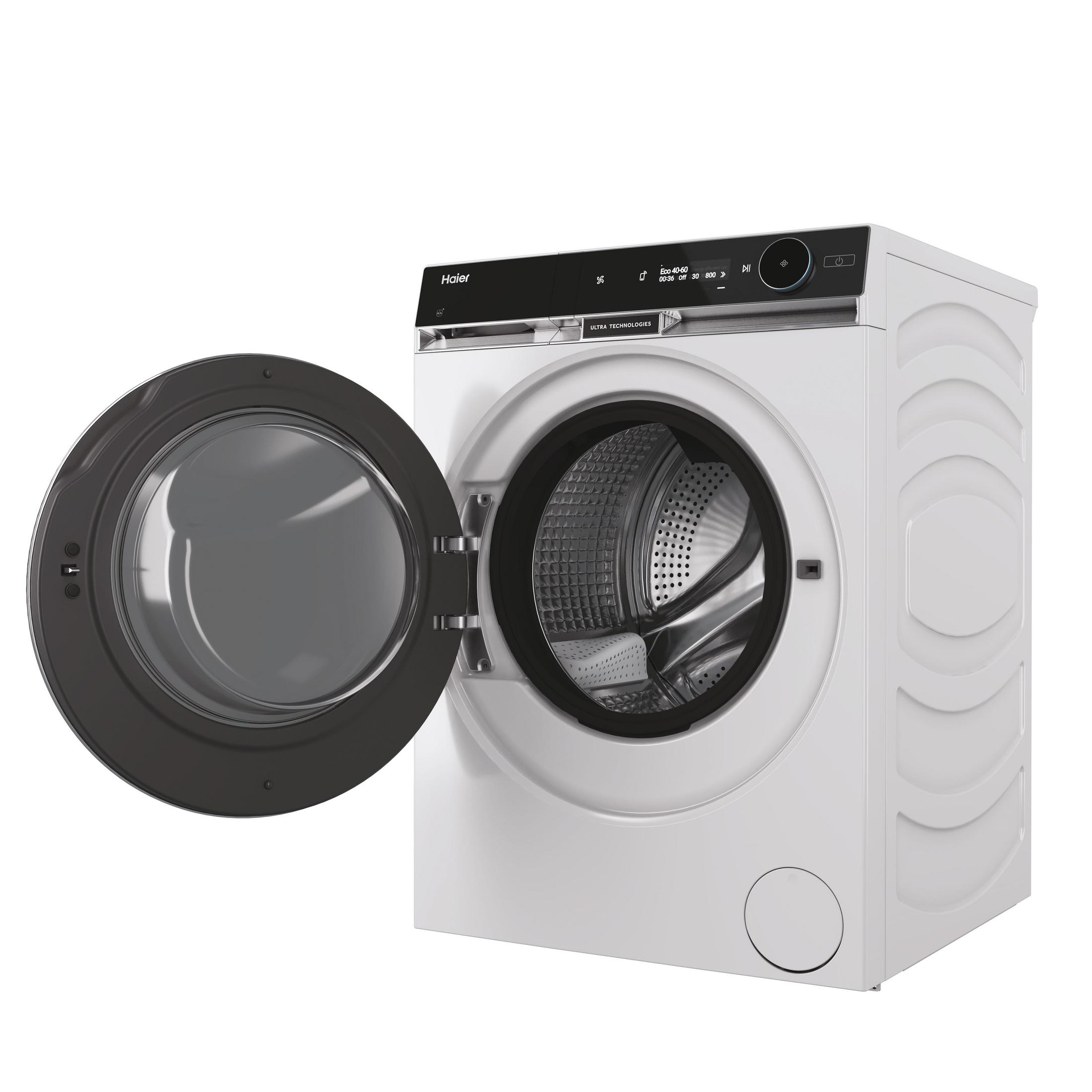 Lavadora Haier blanca con puerta abierta, mostrando el tambor. Pantalla muestra Eco 40-60.