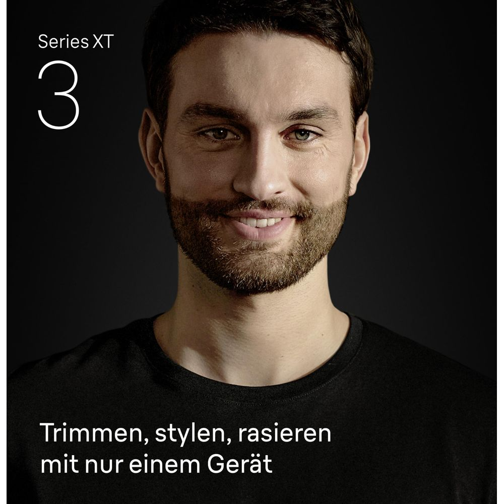 Uśmiechnięty mężczyzna z brodą. "Series XT 3" w lewym górnym rogu.