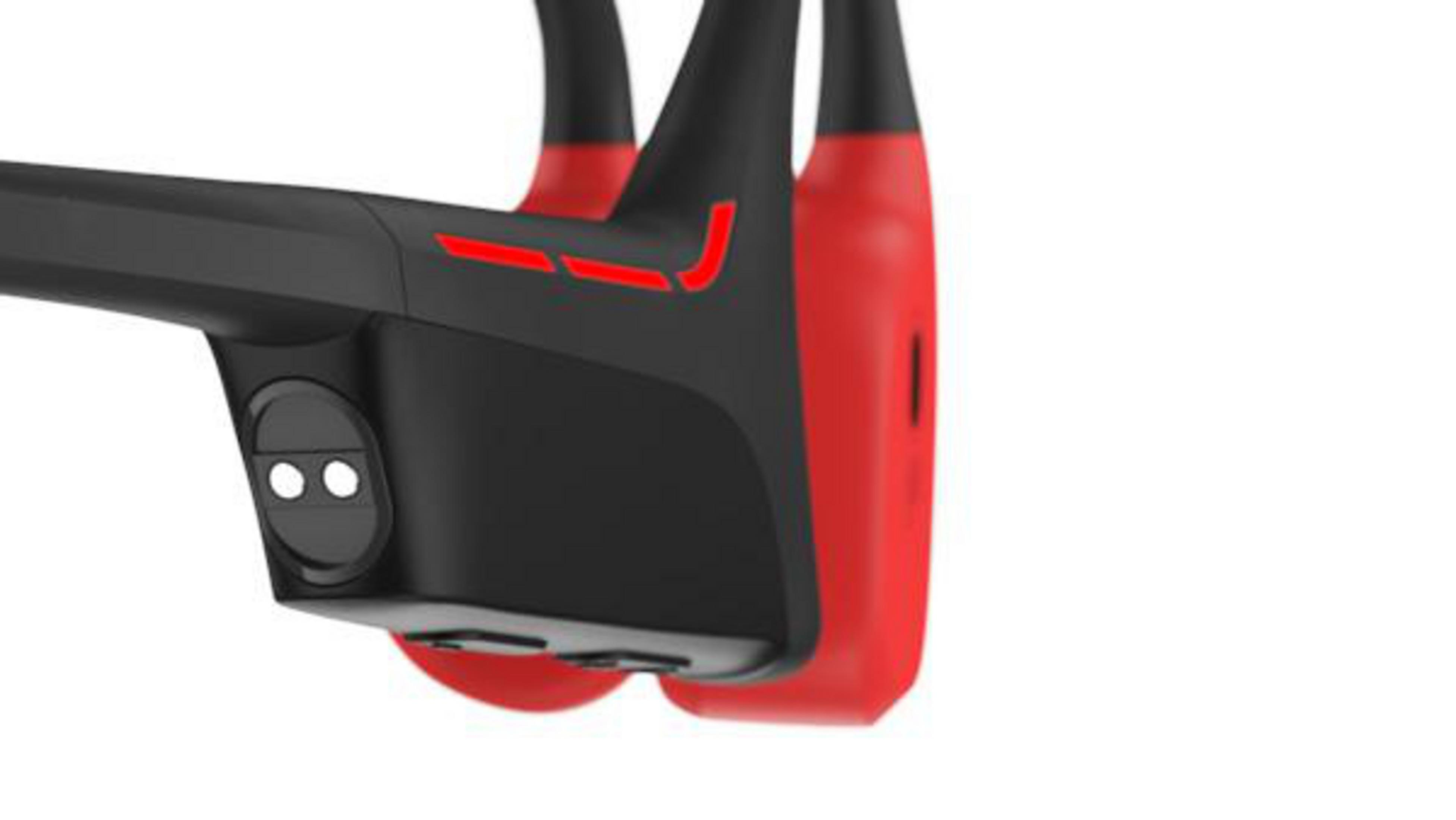 Czarne słuchawki z czerwonymi akcentami i dwoma małymi okrągłymi światłami.