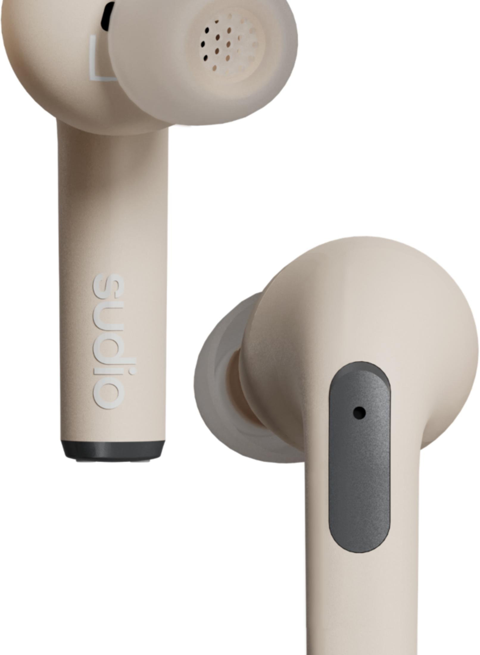 Dwa beżowe słuchawki z szarym detalem i wzorem głośnika.