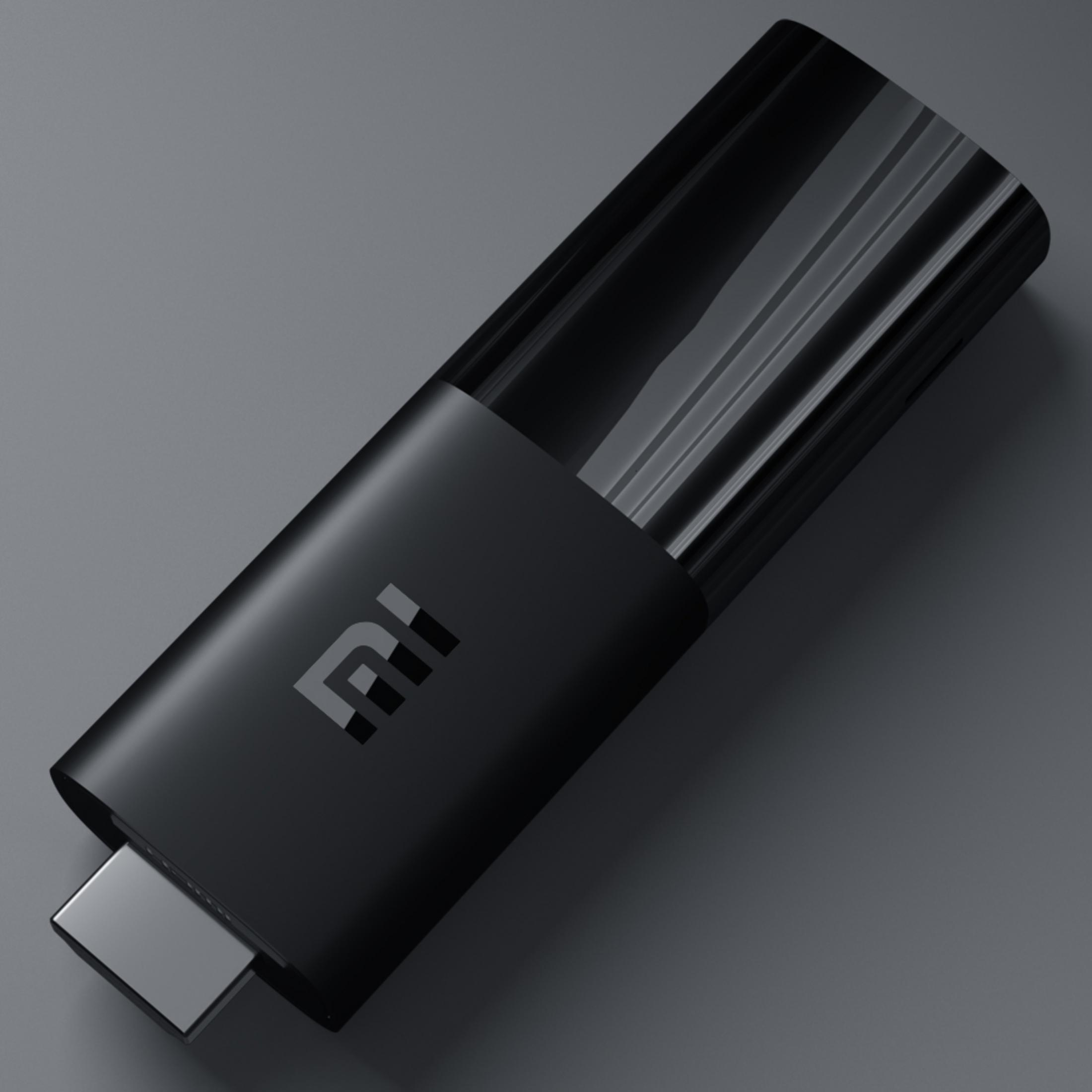 Ein schwarzer Streaming-Stick mit HDMI-Anschluss und dem Mi-Logo.