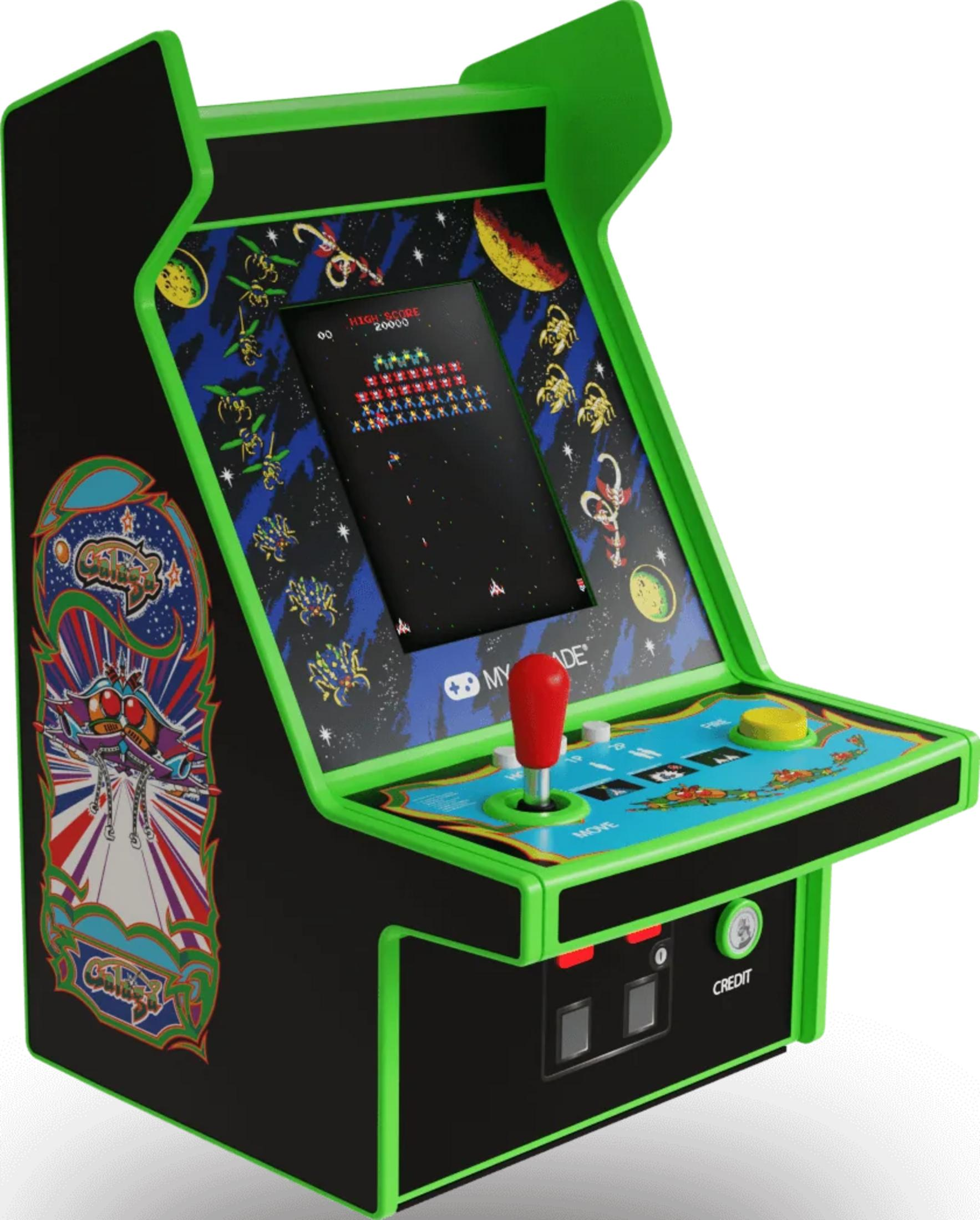 Czarna maszyna zręcznościowa z zielonymi akcentami, z grą kosmiczną na ekranie.
