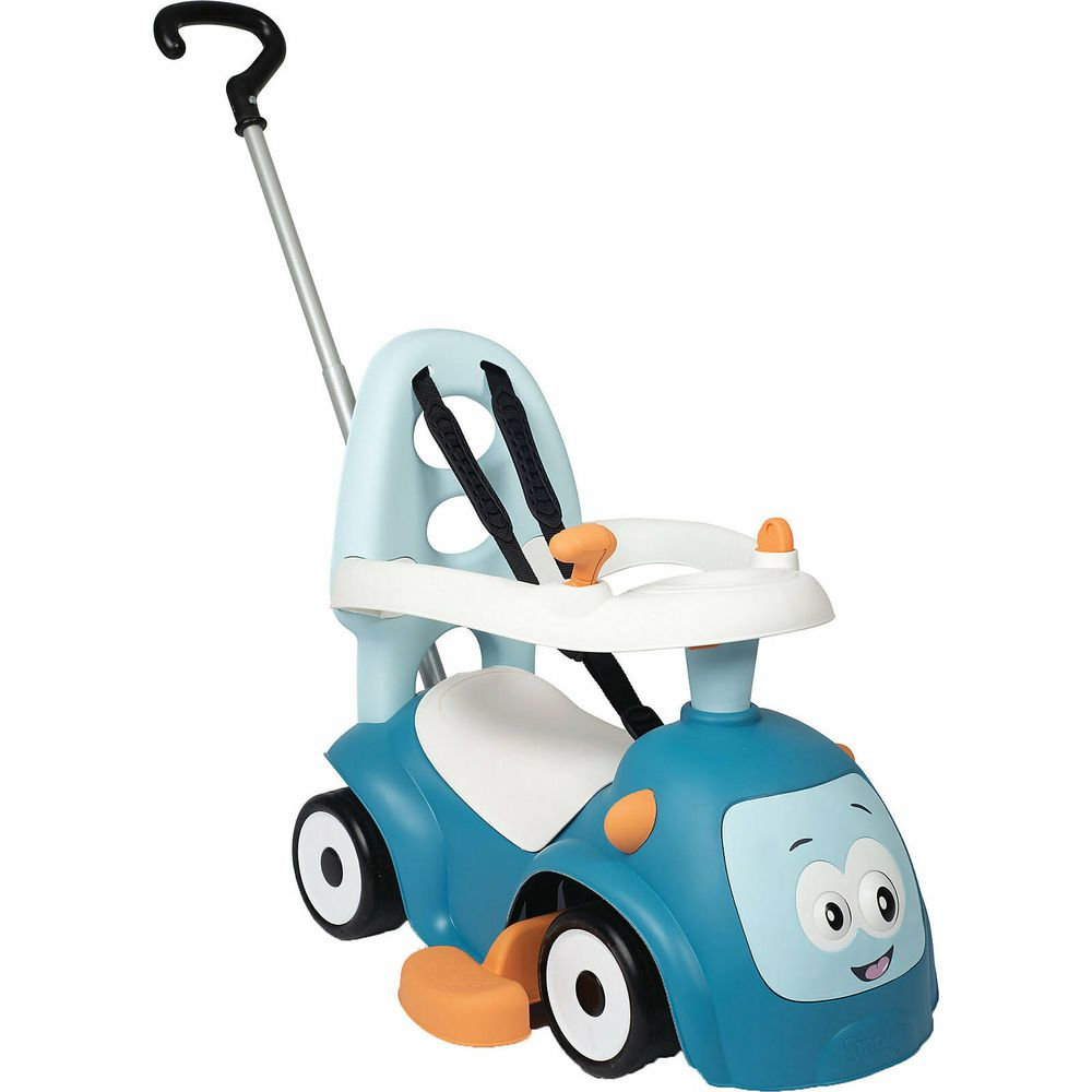 Niebieski jeździk z twarzą, rączką i pasami bezpieczeństwa.