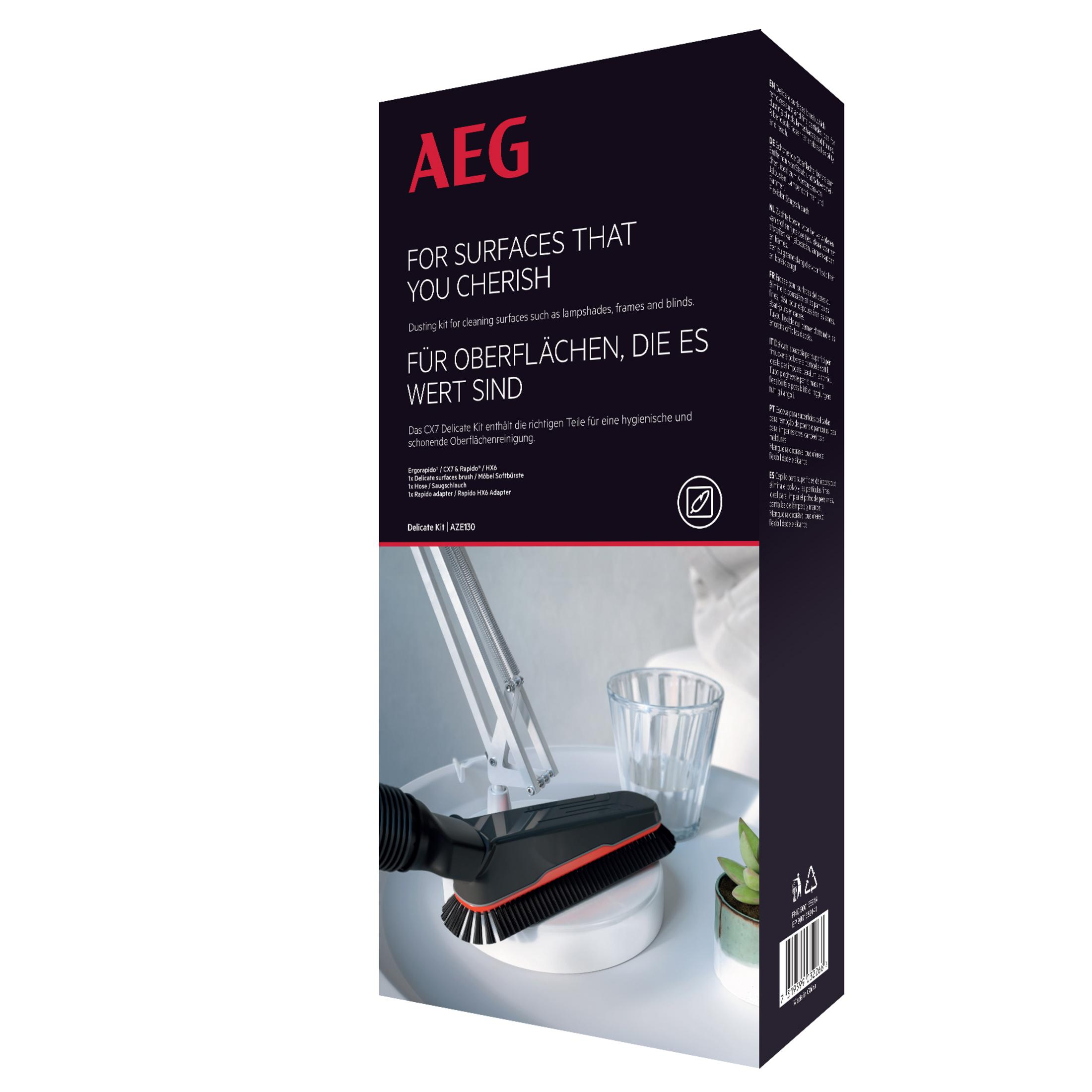 Spazzola aspirapolvere AEG Delicate Kit con setole e adattatore su tavolo bianco.