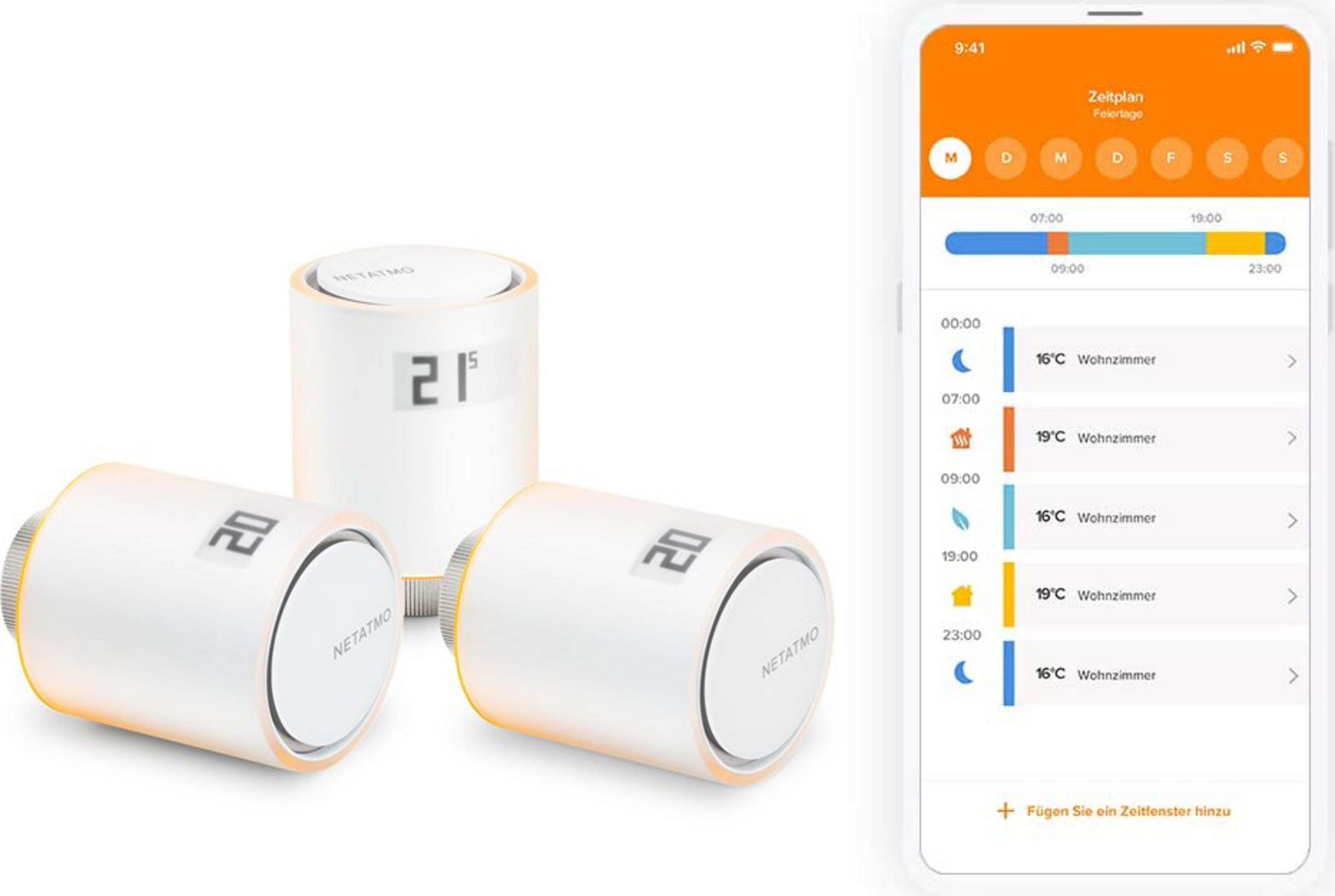 White thermostat heads and a smartphone displaying a heating schedule app.