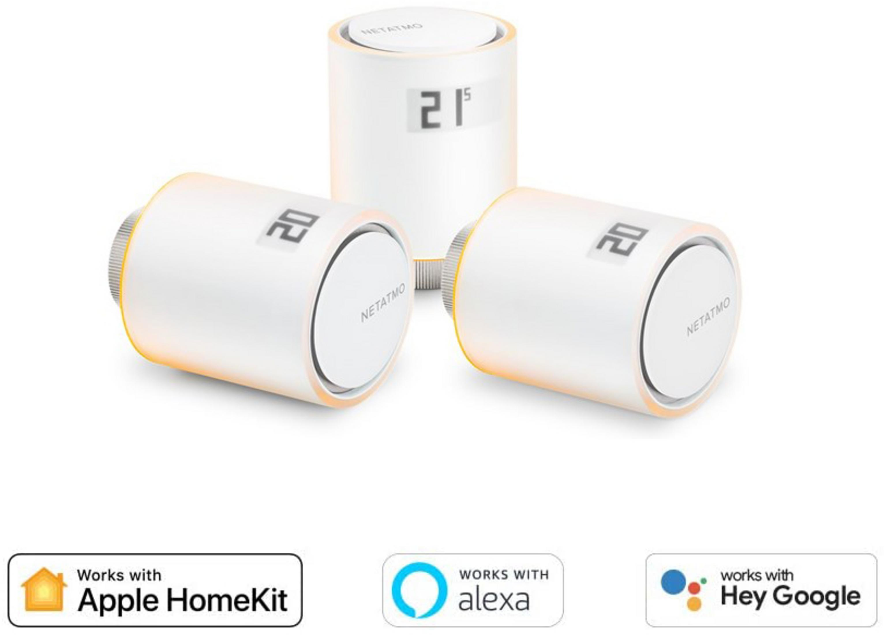 Three white Netatmo radiator valves with digital displays on a white background.