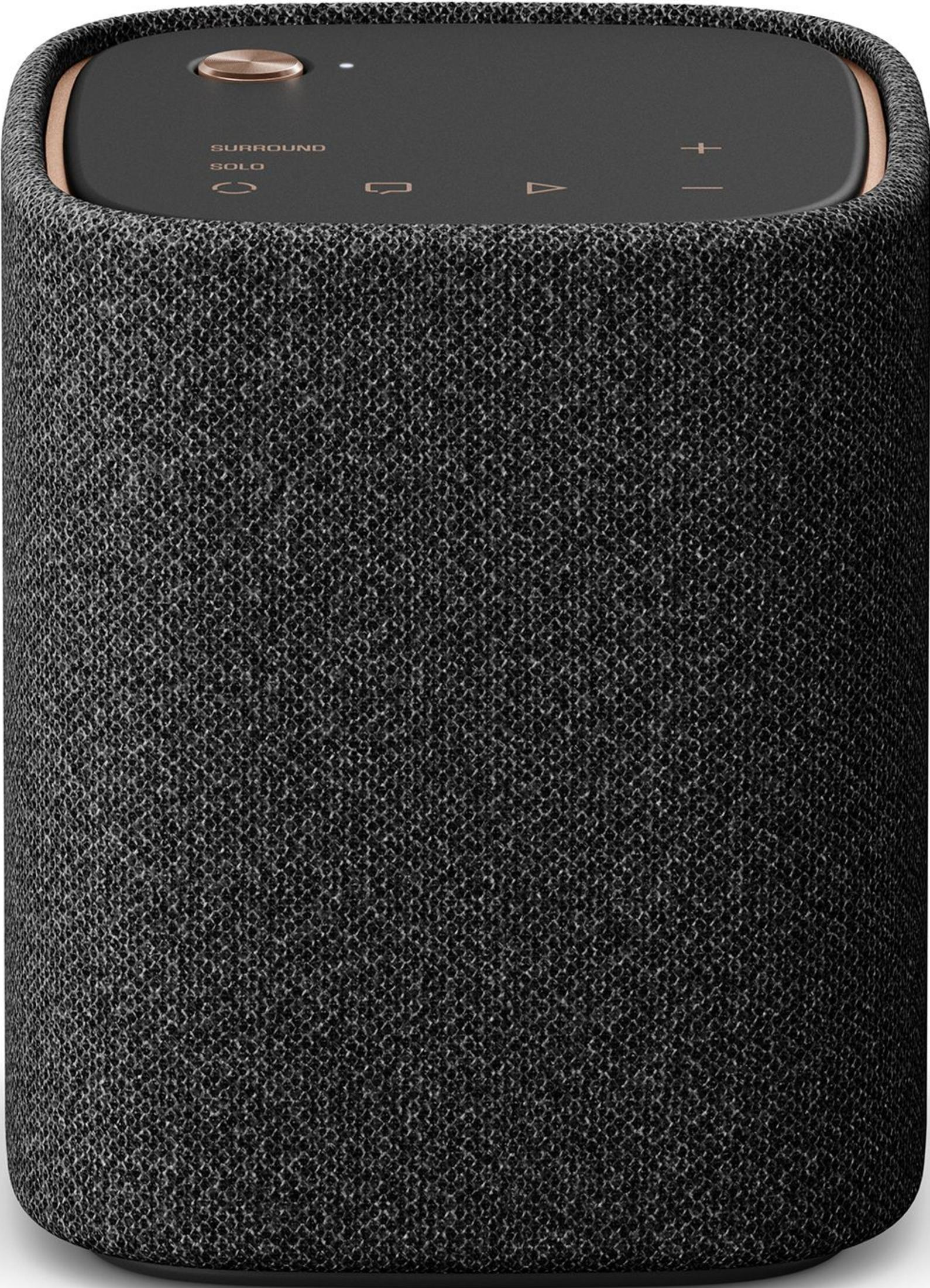 Ciemny, cylindryczny głośnik z przyciskami sterującymi i miedzianymi akcentami.