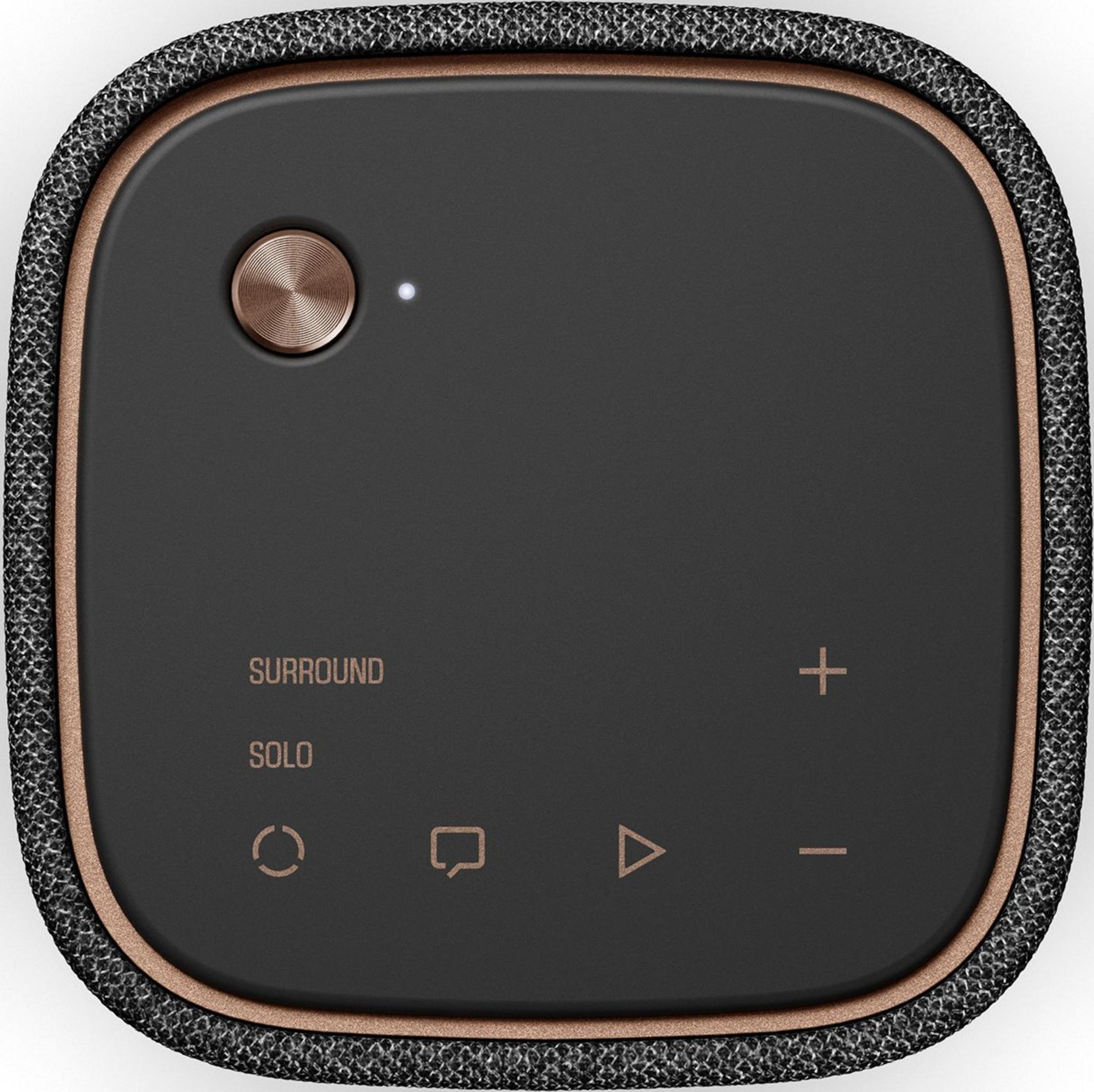 Czarny głośnik z miedzianą ramką i przyciskami sterowania.