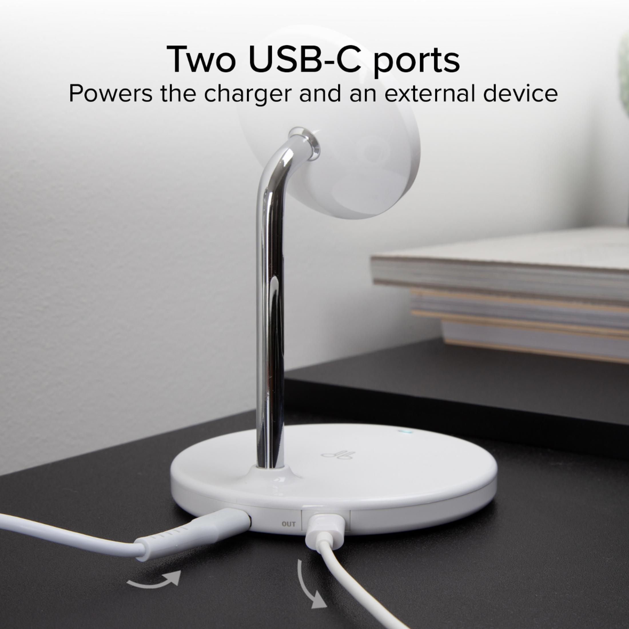 Un cargador blanco con dos puertos USB-C en una mesa negra.
