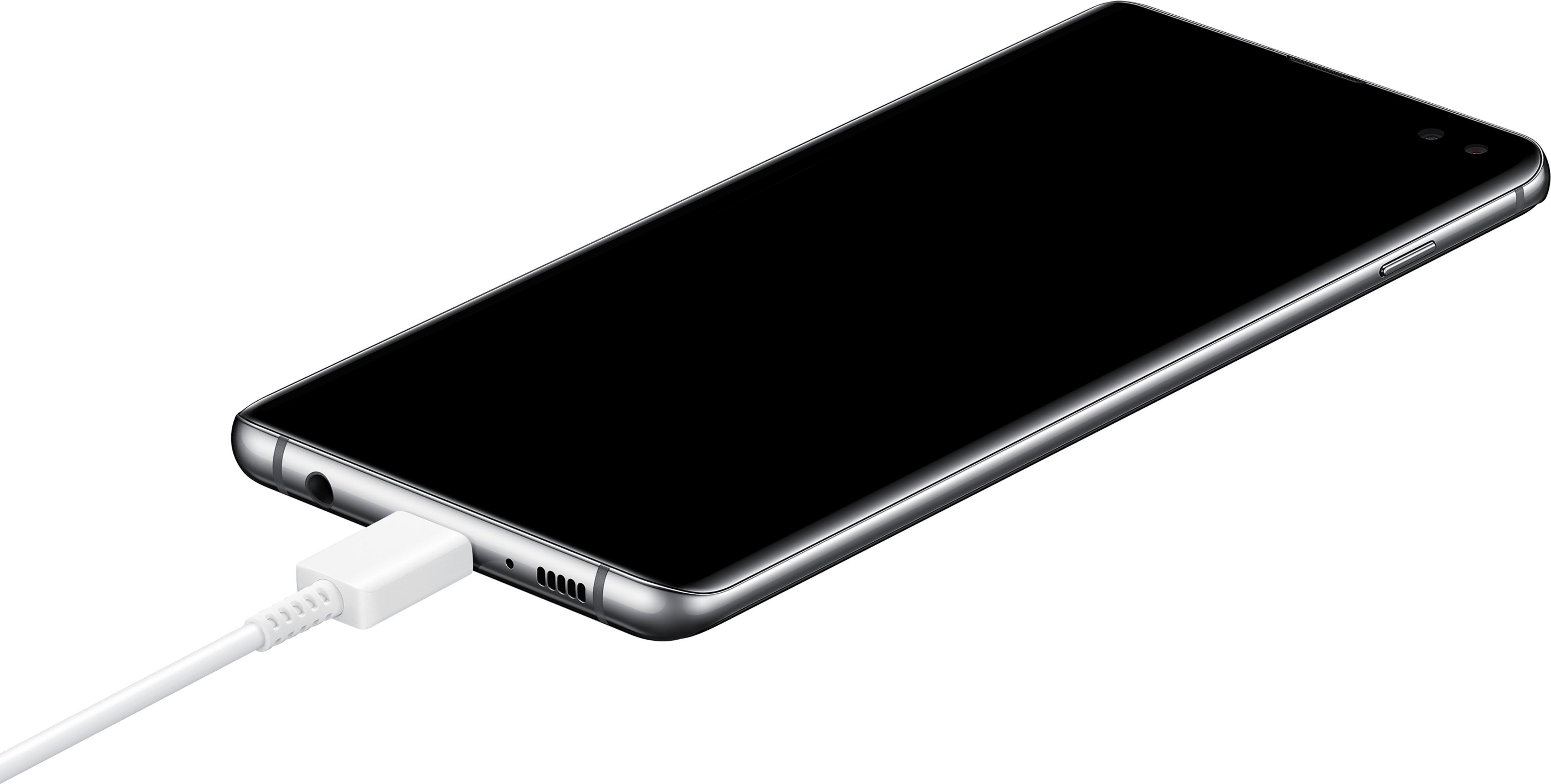 Ein schwarzes Smartphone wird über ein weißes Kabel aufgeladen.