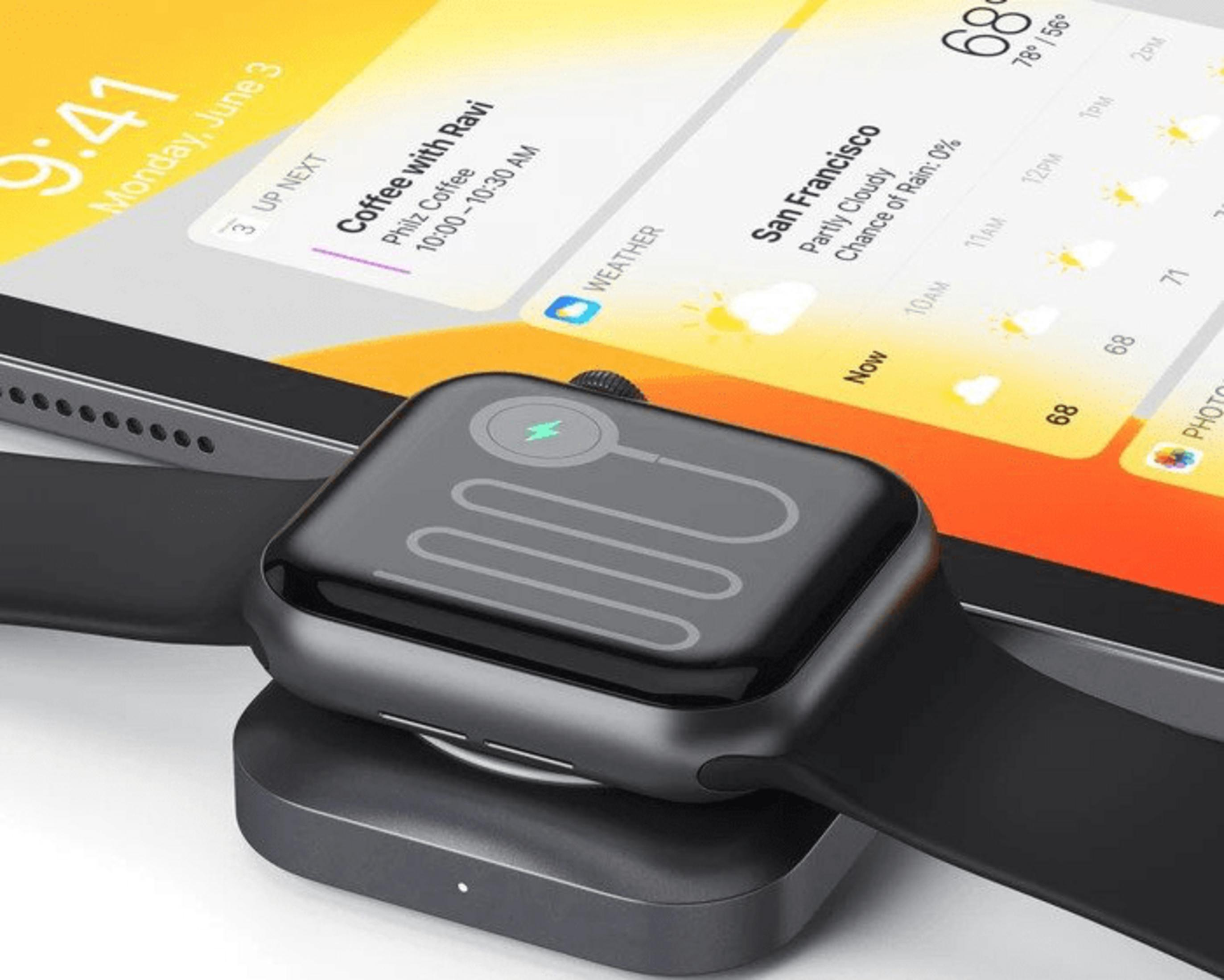 Smartwatch ładuje się na ładowarce, obok tablet z widżetami pogody i kalendarza.